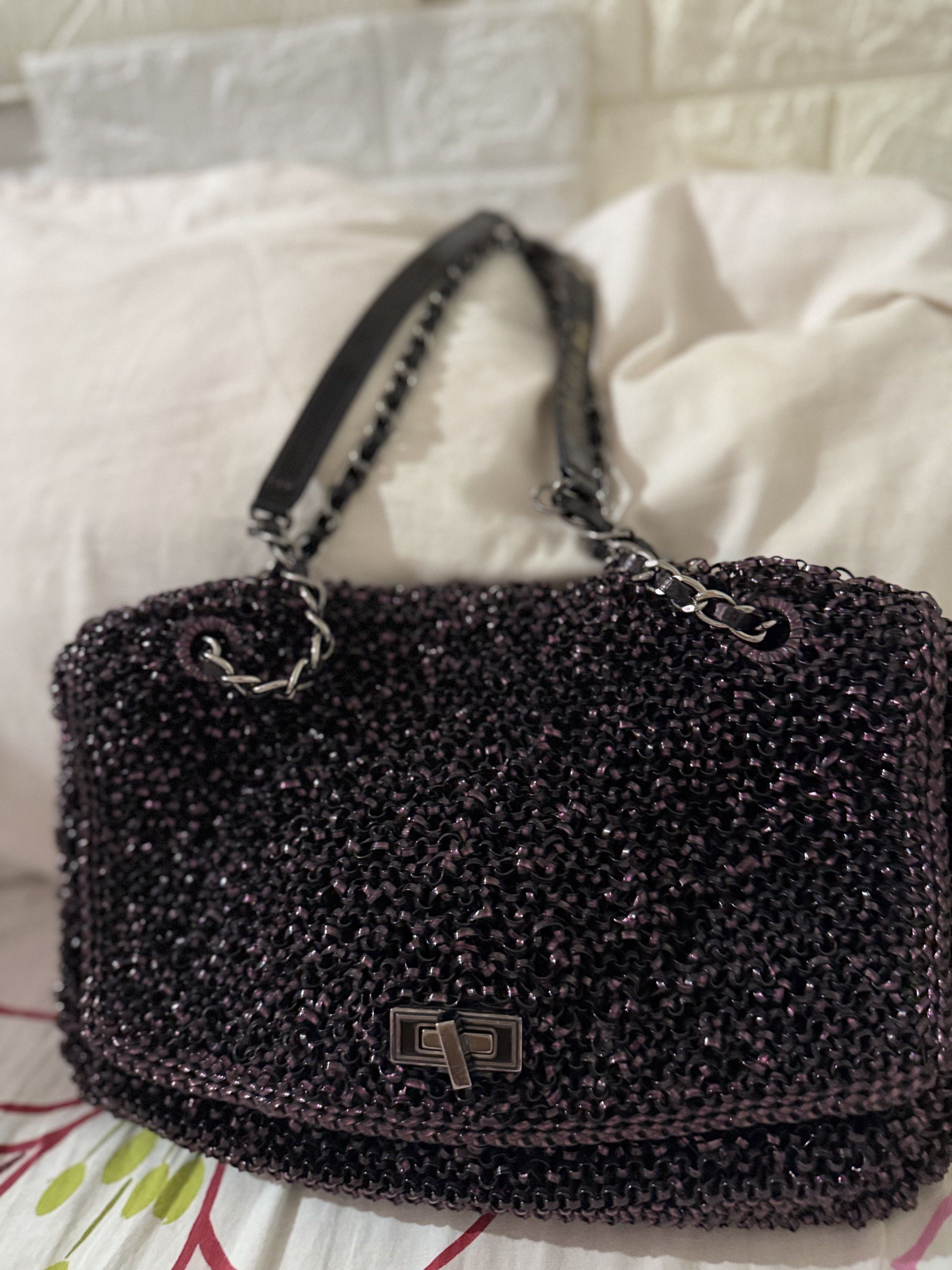 Chain Strap Handbag (Category: Luxury Bags & Wallets) located in Quezon City. Submitted by csa22 (Listing ID 1419286592, Image 1). Description: - Dark purple handbag - Unique chain strap design - Metallic clasp closure - Woven exterior - Shoulder strap with wear - Interior condition not specified.