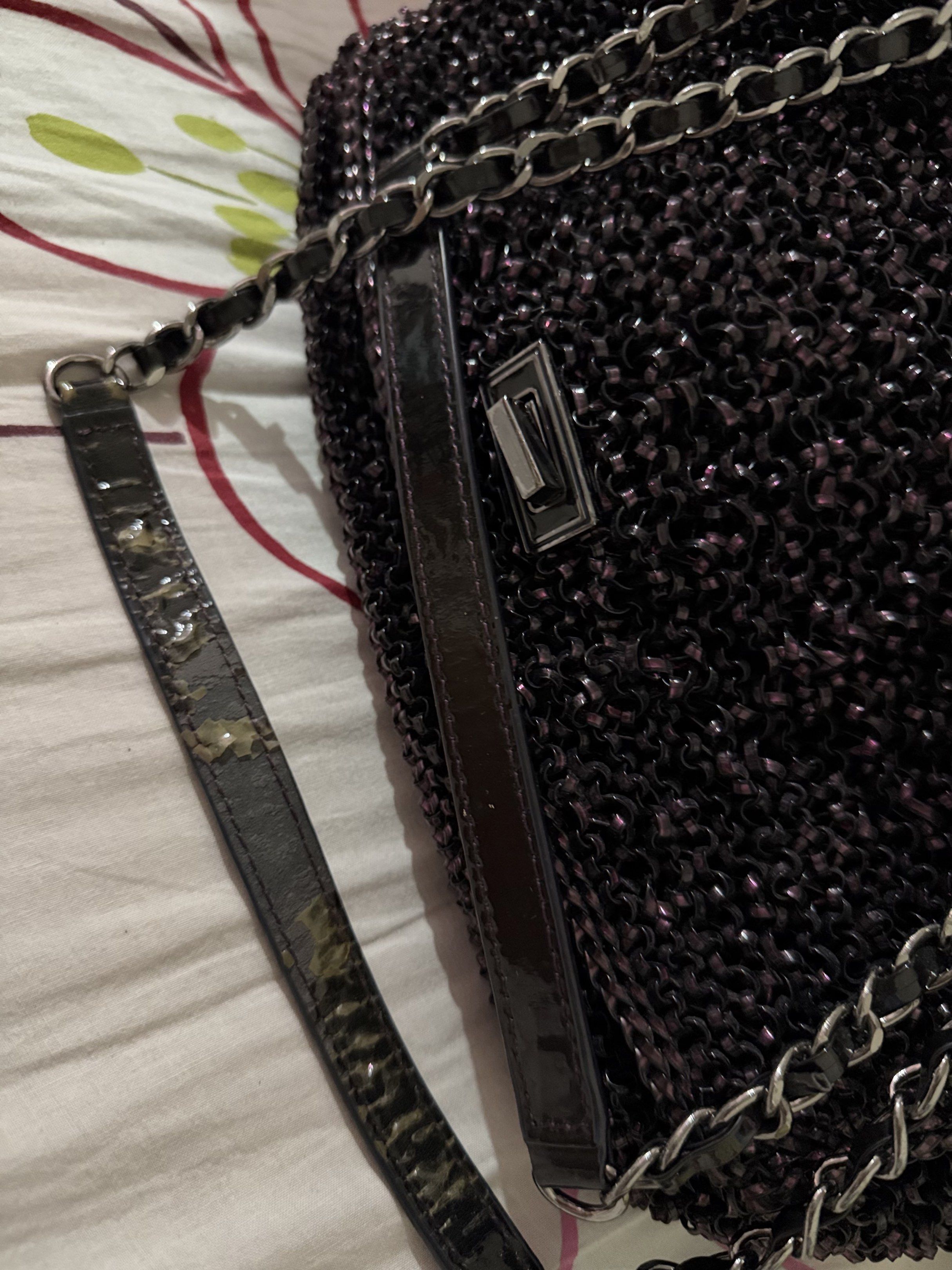 Chain Strap Handbag (Category: Luxury Bags & Wallets) located in Quezon City. Submitted by csa22 (Listing ID 1419286592, Image 3). Description: - Dark purple handbag - Unique chain strap design - Metallic clasp closure - Woven exterior - Shoulder strap with wear - Interior condition not specified.
