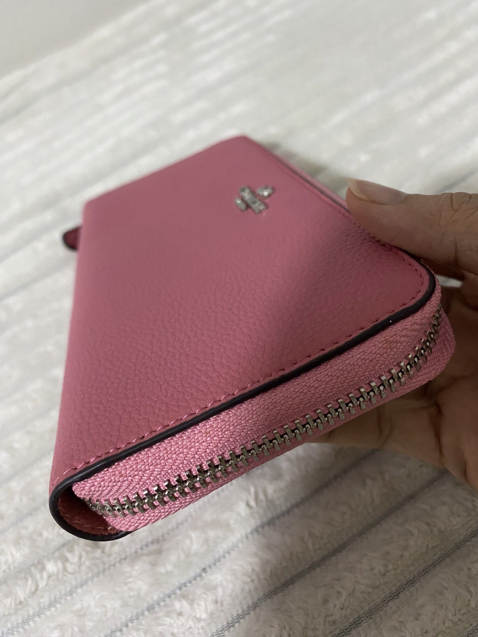 Coach Zip Around Pink Wallet (Category: Luxury Bags & Wallets) located in Santa Rosa. Submitted by sassycollection. (Listing ID 1419383015, Image 2). Description: - Authentic Coach wallet - Zip-around closure - Pink color - Multiple card slots and compartments - Made in Vietnam - Silver zipper - Coach logo on front.