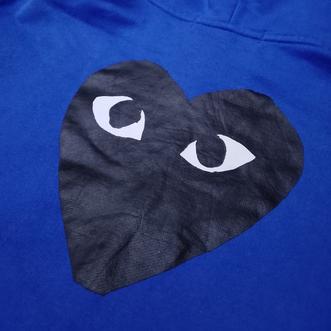Comme des Garcons Play Hoodie - Blue (Category: Coats, Jackets and Outerwear) located in Manila. Submitted by moisky18 (Listing ID 1419223772, Image 3). Description: - Comme des Garcons Play hoodie - Color: Blue - Size: M - Full zip closure - Hood with black drawstrings - Two front pockets - Embroidered heart logo on chest.