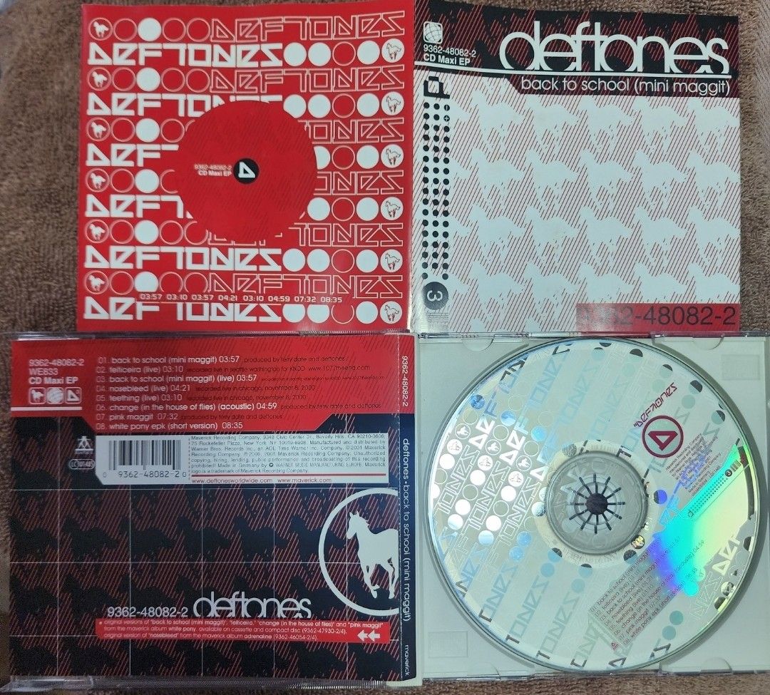 Deftones - Back to School (Mini Maggit) EP (Category: CDs & DVDs) located in Cebu City. Submitted by g_roshamboo (Listing ID 1419336717, Image 2). Description: Deftones "Back to School (Mini Maggit)" CD Maxi EP. Includes tracks like "Back to School (Mini Maggit)", "Engine No. 9 (Live)", and "Change (In the House of Flies) (Acoustic)". The CD and case are included. The CD has a silver surface with the Deftones logo. The case has a red and white de