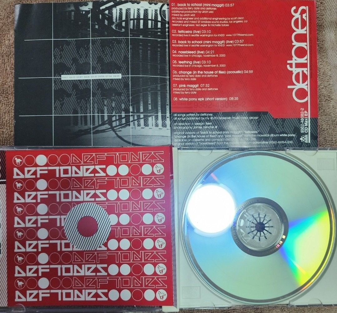 Deftones - Back to School (Mini Maggit) EP (Category: CDs & DVDs) located in Cebu City. Submitted by g_roshamboo (Listing ID 1419336717, Image 3). Description: Deftones "Back to School (Mini Maggit)" CD Maxi EP. Includes tracks like "Back to School (Mini Maggit)", "Engine No. 9 (Live)", and "Change (In the House of Flies) (Acoustic)". The CD and case are included. The CD has a silver surface with the Deftones logo. The case has a red and white de