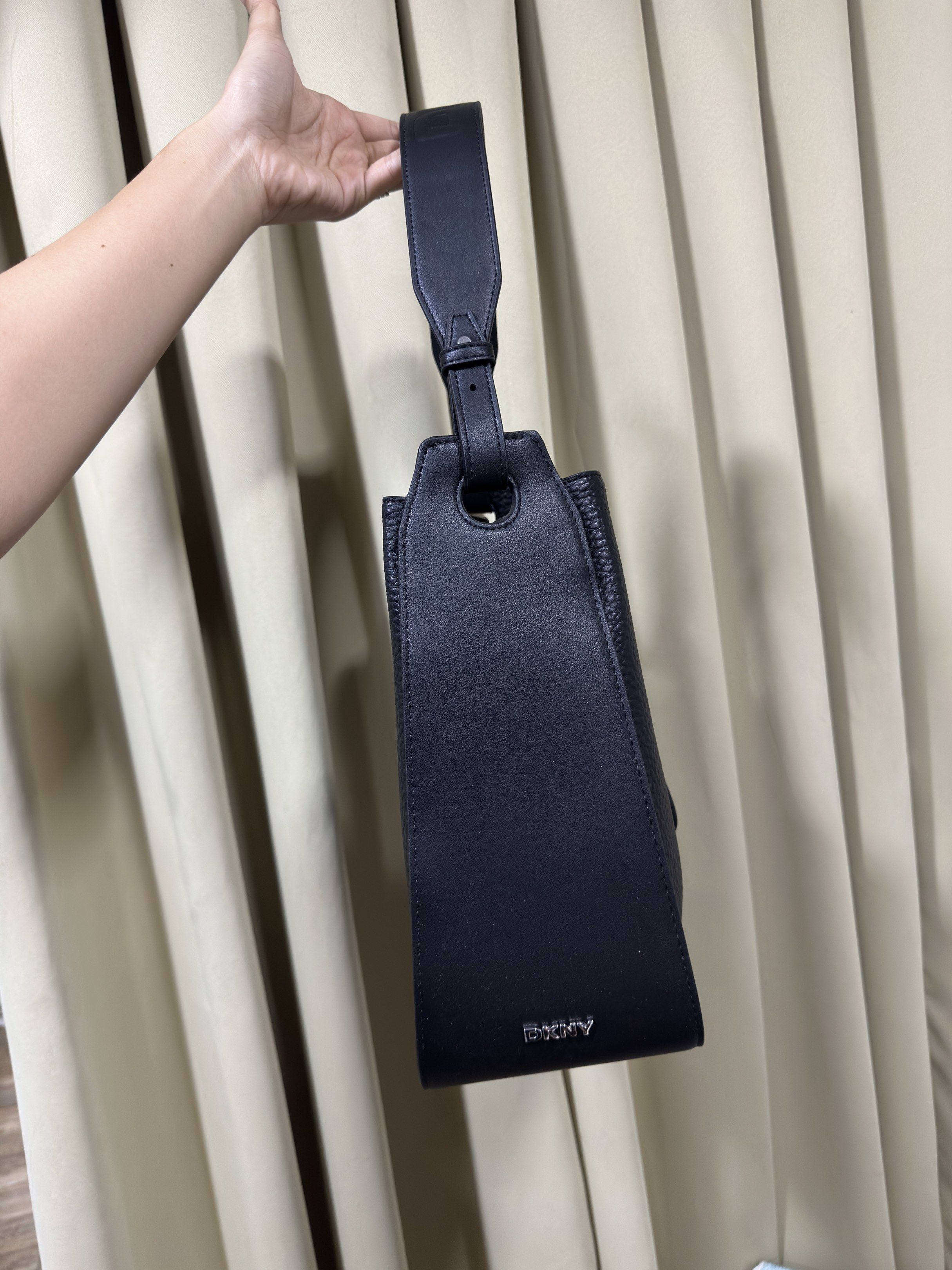 DKNY Black leather Bucket Bag (Category: Luxury Bags & Wallets) located in Rizal. Submitted by GirlDeclutter (Listing ID 1419319049, Image 3). Description: - Black DKNY bucket bag - Drawstring closure - Top handle and detachable shoulder strap - Interior zippered pocket - Made of textured leather - Silver-tone hardware - Includes DKNY tag I bought it in the USA for $154..