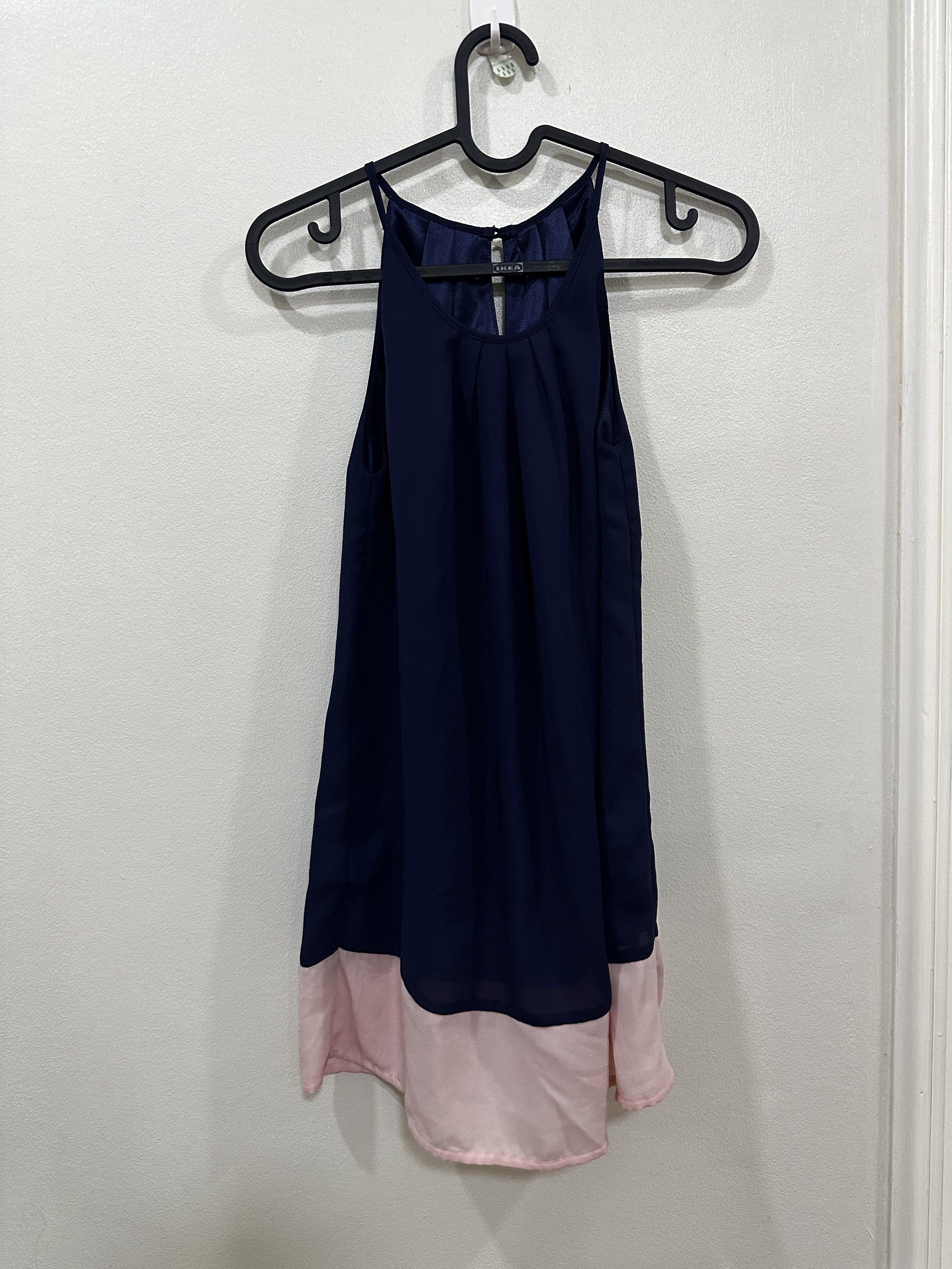 Forme Navy Blue and Pink Top (Category: Blouses) located in Quezon City. Submitted by declutter___mnl (Listing ID 1419273754, Image 1). Description: - Forme halter top - Navy blue with pink hem - Flowy design - Made of 100% polyester.