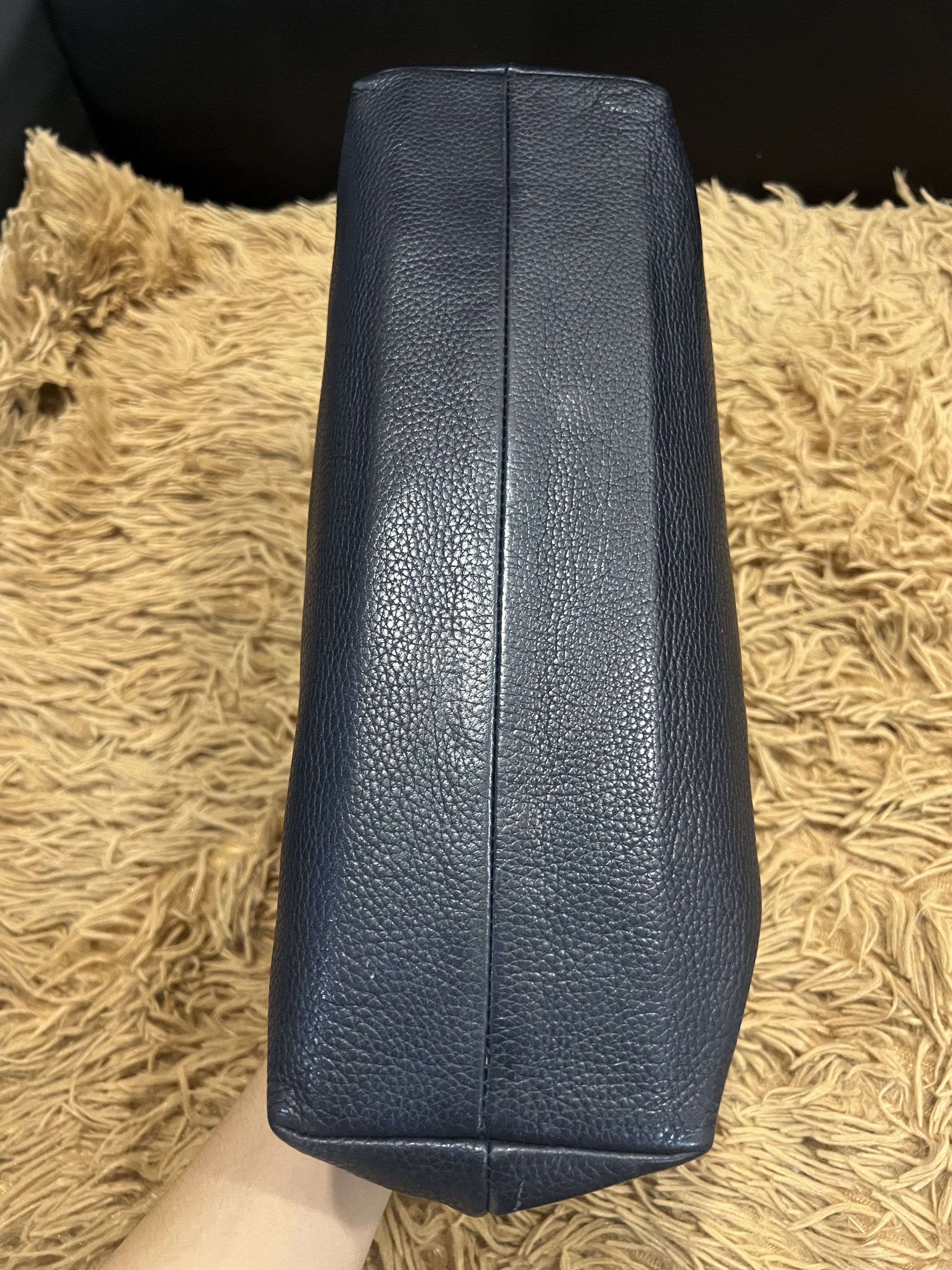 Gianni Versace Navy Clutch (Category: Luxury Bags & Wallets) located in Lipa City. Submitted by thyra06 (Listing ID 1419253983, Image 3). Description: - Gianni Versace navy clutch - Gold-tone Medusa head emblem - Gold-tone zipper pull with Versace logo - Rectangular shape - Made in Italy.