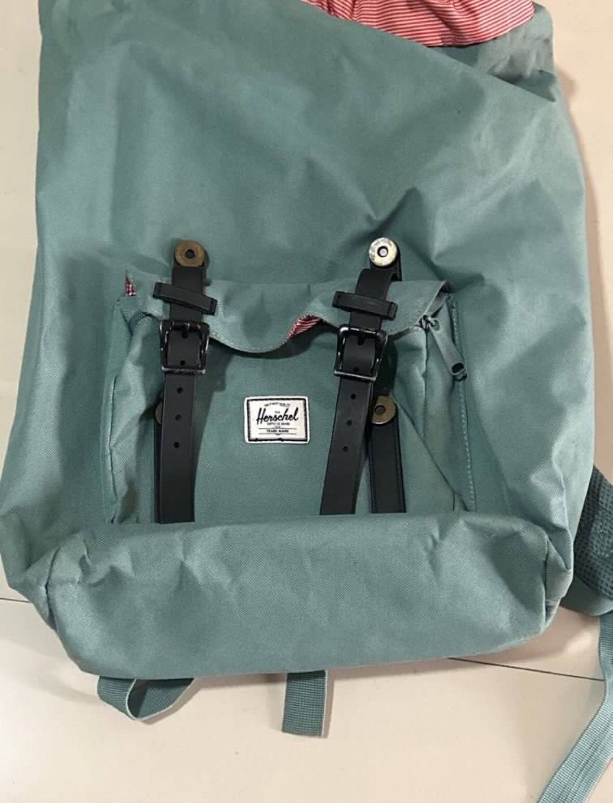 Herschel Supply Co. Backpack with Laptop Sleeve (Category: Backpacks) located in Manila. Submitted by wardrobepurgeph (Listing ID 1419337088, Image 2). Description: - Herschel Supply Co. backpack - Teal color (a bit dirty but can be cleaned) - Black straps and buckles in good condition - Red and white striped interior lining - WITH laptop sleeve that fits big laptops - Front pocket with zipper and hook inside - Adjustable shoulder straps - Hersch
