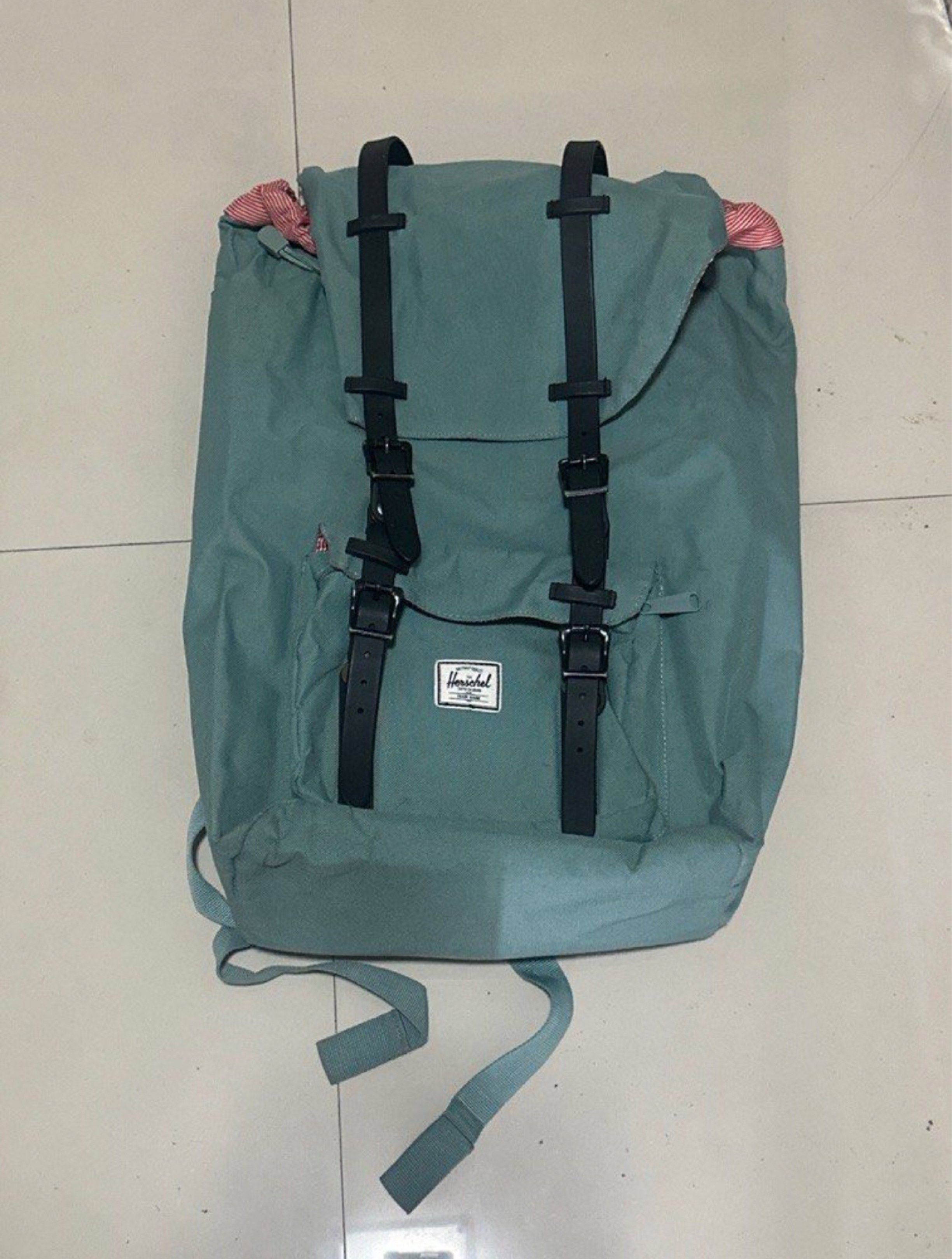 Herschel Supply Co. Backpack with Laptop Sleeve (Category: Backpacks) located in Manila. Submitted by wardrobepurgeph (Listing ID 1419337088, Image 1). Description: - Herschel Supply Co. backpack - Teal color (a bit dirty but can be cleaned) - Black straps and buckles in good condition - Red and white striped interior lining - WITH laptop sleeve that fits big laptops - Front pocket with zipper and hook inside - Adjustable shoulder straps - Hersch