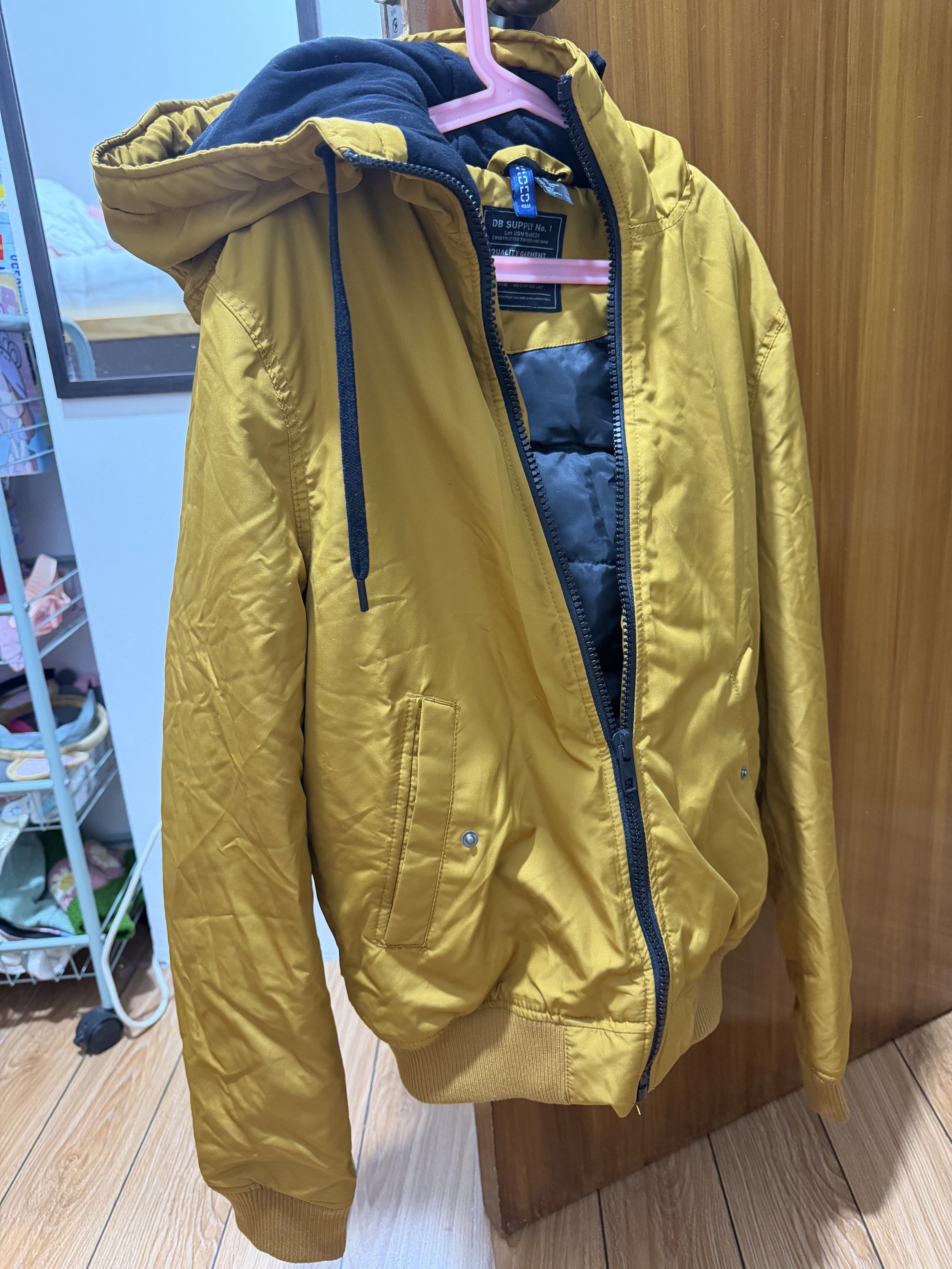 H&M DB S Jacket - XS (Category: Coats, Jackets and Outerwear) located in Manila. Submitted by eah0416 (Listing ID 1419300959, Image 2). Description: - H&M mustard yellow jacket - Black hood and lining - Size: XS - Zipper closure - Two front pockets - Ribbed hem and cuffs.