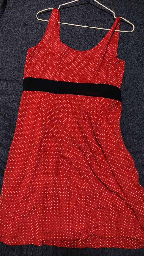 H&M Red Polka Dot Dress with Bow (Category: Dresses) located in Caloocan City. Submitted by declutterwithcath (Listing ID 1419313252, Image 2). Description: - H&M red dress with white polka dots - Features a black bow at the waist - Sleeveless design - Scoop neckline - Flattering A-line silhouette - Knee-length - Made of lightweight fabric.