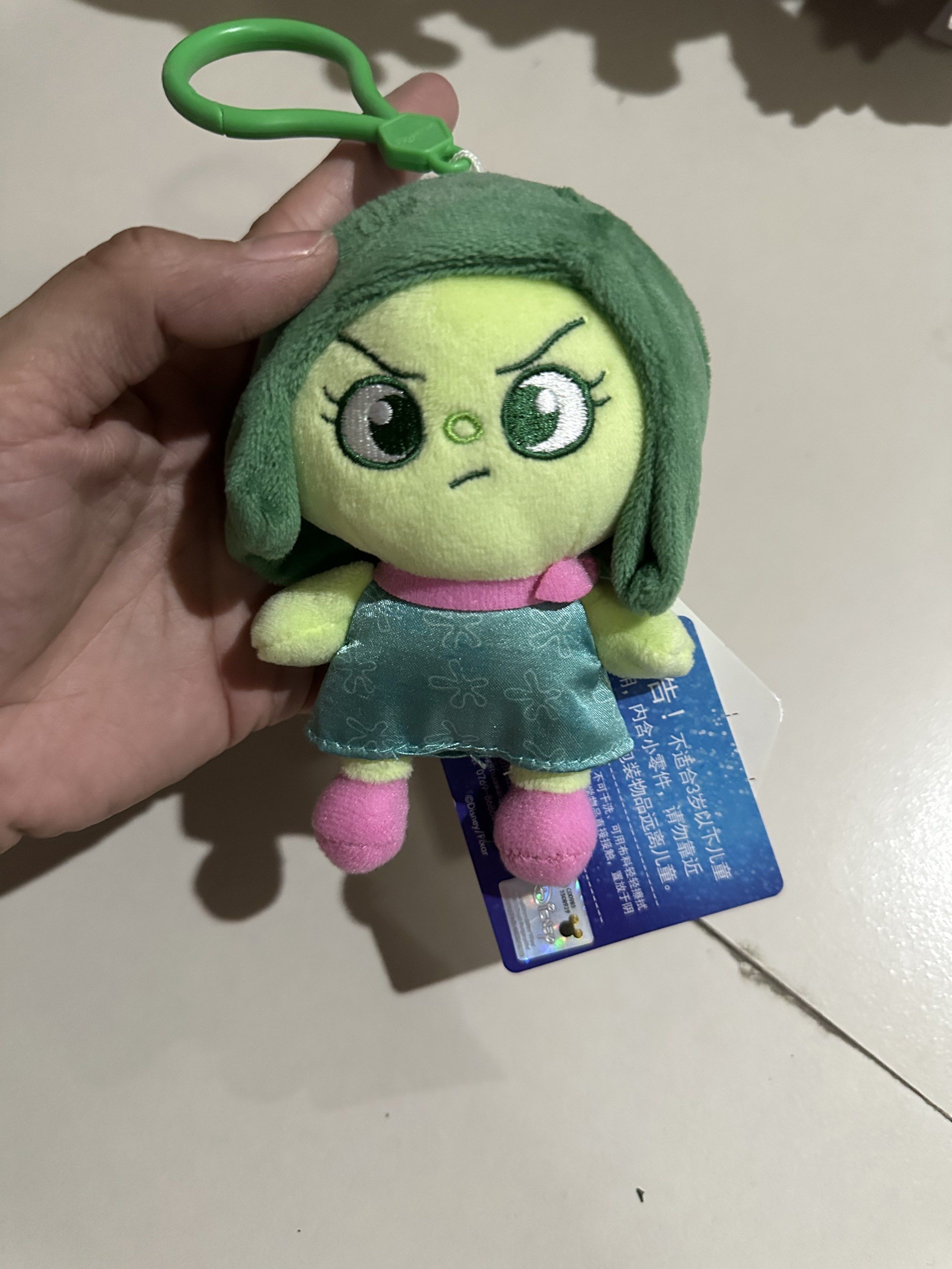 Inside Out 2 Disgust Keychain w tag (Category: Plushies & Soft Toys) located in Manila. Submitted by itsyourgirlmc (Listing ID 1419303344, Image 1). Description: - Inside Out 2 Disgust Keychain - Features Disgust in plush form - Includes a green clip - Comes with a Daiso Japan tag - Perfect for Inside Out fans! - Collectible item.