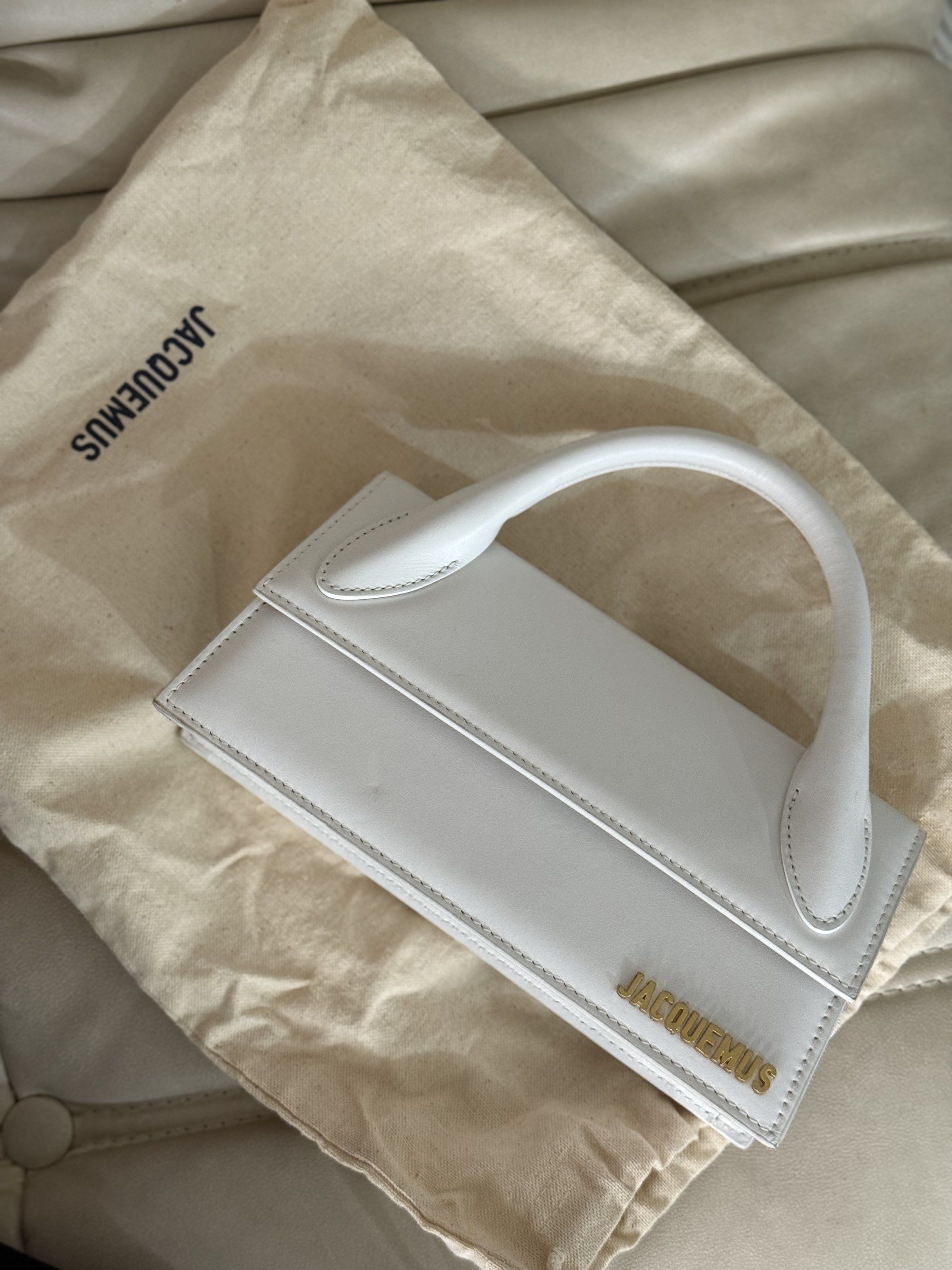 Jacquemus Le Chiquito White Handbag (Category: Luxury Bags & Wallets) located in Marikina City. Submitted by lovegoeson (Listing ID 1419377329, Image 1). Description: - Authentic Jacquemus Le Chiquito handbag - Color: White - Features top handle and detachable shoulder strap - Includes dust bag and authenticity card - Gold-tone logo - Made in Italy.