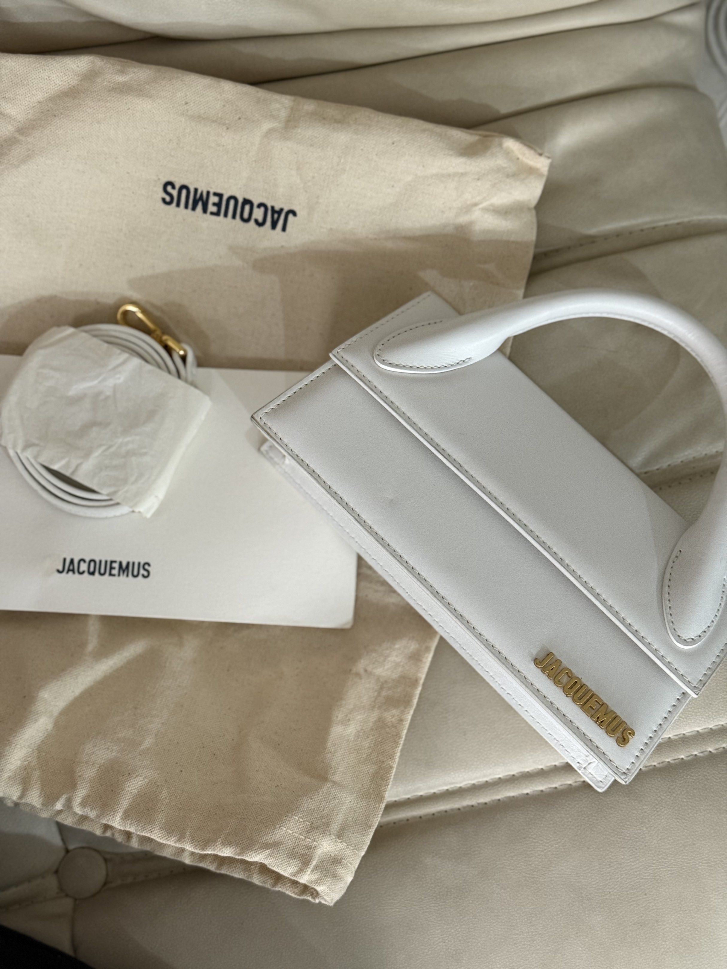 Jacquemus Le Chiquito White Handbag (Category: Luxury Bags & Wallets) located in Marikina City. Submitted by lovegoeson (Listing ID 1419377329, Image 2). Description: - Authentic Jacquemus Le Chiquito handbag - Color: White - Features top handle and detachable shoulder strap - Includes dust bag and authenticity card - Gold-tone logo - Made in Italy.