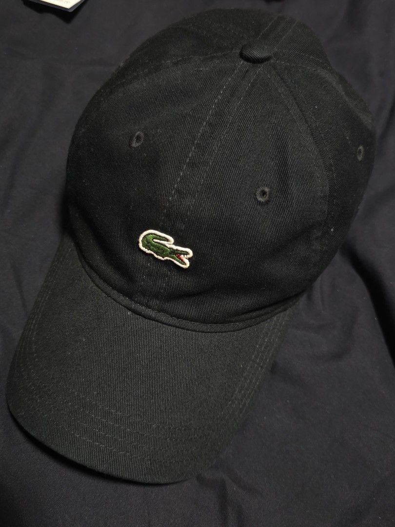 Lacoste Black Cap (Category: Caps & Hats) located in Quezon City. Submitted by yGGGG (Listing ID 1419245877, Image 3). Description: - Black Lacoste cap - Iconic crocodile logo - Curved brim - Adjustable strap - Green Lacoste branded taping inside - Made in Vietnam - Durable fabric.
