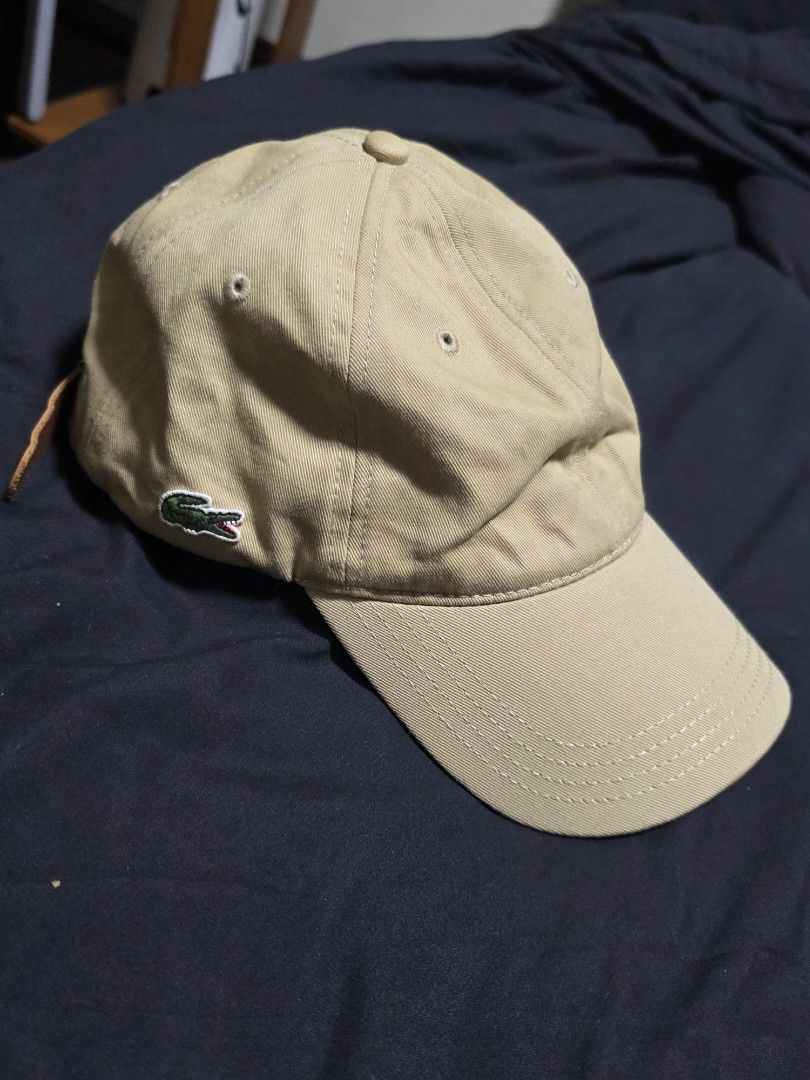 Lacoste Cap (Category: Caps & Hats) located in Quezon City. Submitted by yGGGG (Listing ID 1419242306, Image 1). Description: - Authentic Lacoste cap - Brandnew original - Neutral beige color - Iconic Lacoste crocodile logo - Adjustable leather strap - Includes original tags - One size fits all.