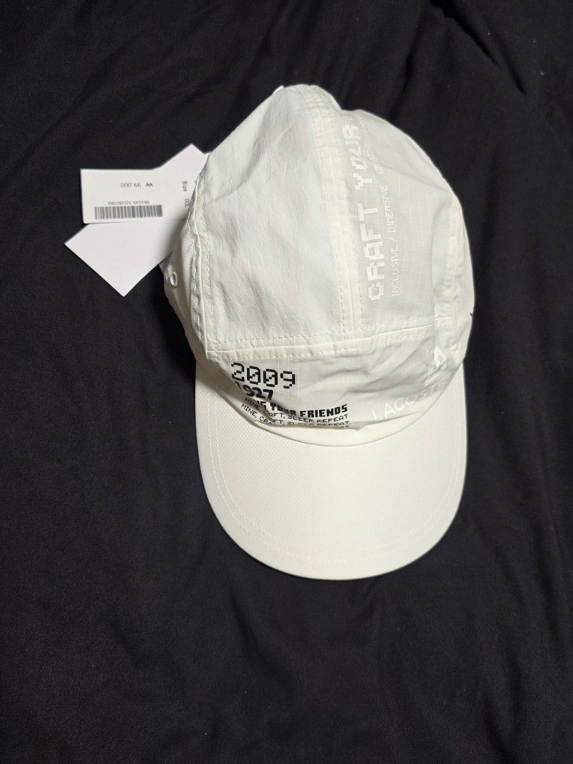 Lacoste Minecraft Cap (Category: Caps & Hats) located in Quezon City. Submitted by yGGGG (Listing ID 1419243401, Image 1). Description: Brandnew White Lacoste cap featuring a collaboration with Minecraft. The cap has the Lacoste logo and Minecraft branding on the tag. It has the text "WE WELCOME EVERYONE" and "BRING YOUR FRIENDS" printed on the cap. The cap also has the numbers "2009 1927" printed on it. It has an adjustable strap..