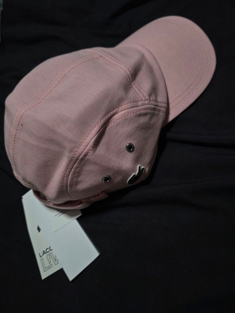 Lacoste Pink Cap (Category: Caps & Hats) located in Quezon City. Submitted by yGGGG (Listing ID 1419247132, Image 2). Description: - Brandnew - Lacoste cap - Soft pink color - Iconic Lacoste logo - Classic design with curved brim - Adjustable strap for a comfortable fit - Unworn condition - Includes original tags.