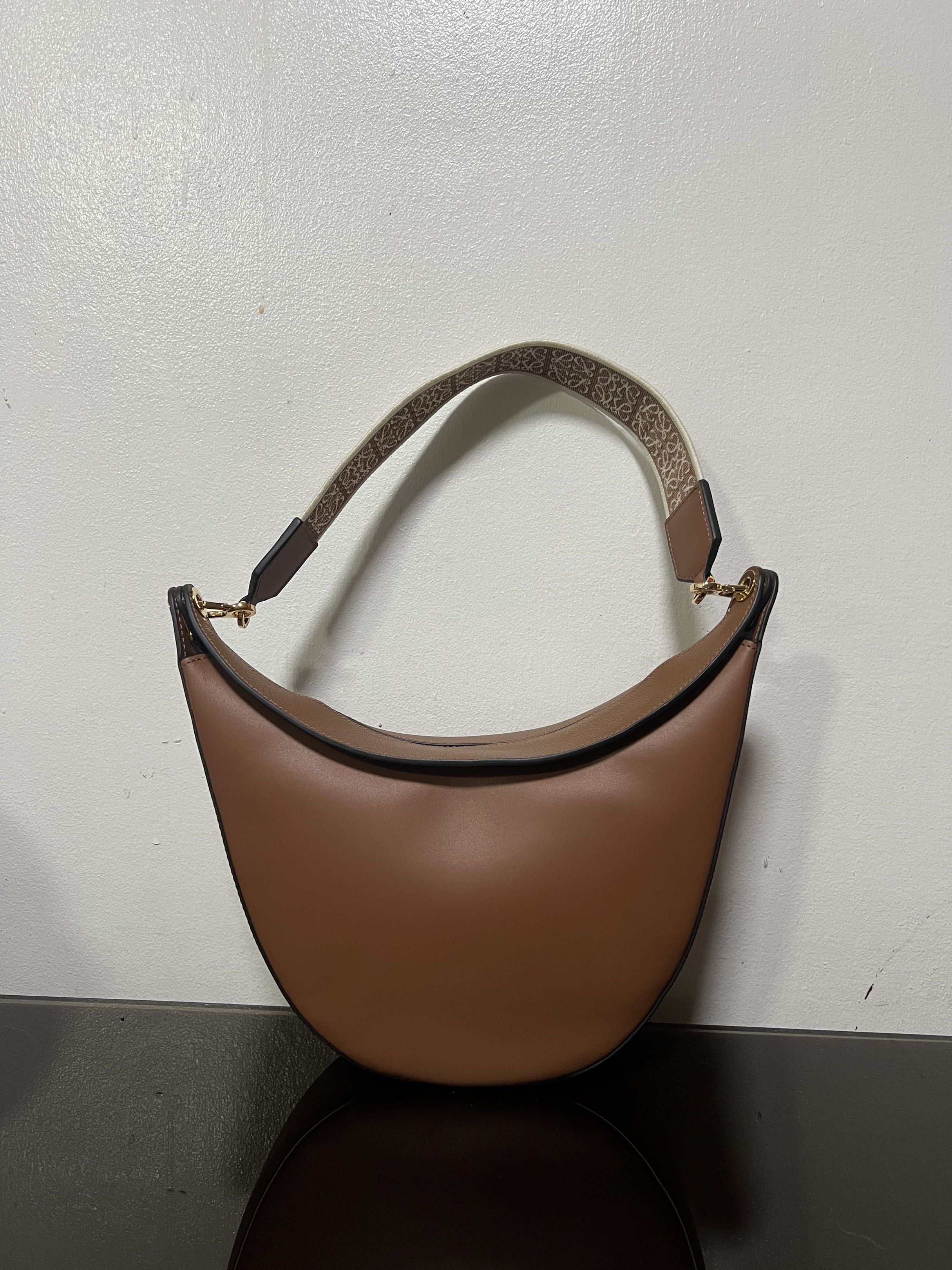 Loewe Luna Shoulder Bag in Brown (Category: Luxury Bags & Wallets) located in Makati City. Submitted by vnz.flrls (Listing ID 1419346974, Image 2). Description: 🎀 8000 Php AUTH NOT GUARANTEED ᡣ𐭩 ྀིྀ Condition: Excellent Condition ᡣ𐭩 ྀིྀ Rating: 10/10 ᡣ𐭩 ྀིྀ Issues / flaws: none ᡣ𐭩 ྀིྀ Color: brown ᡣ𐭩 ྀིྀ Dimensions: 10x2.5x11 inches (LXWxH) ᡣ𐭩 ྀིྀ Inclusions: dust bag - with freebies 🫧 Note: please manage your expectations, might have sig