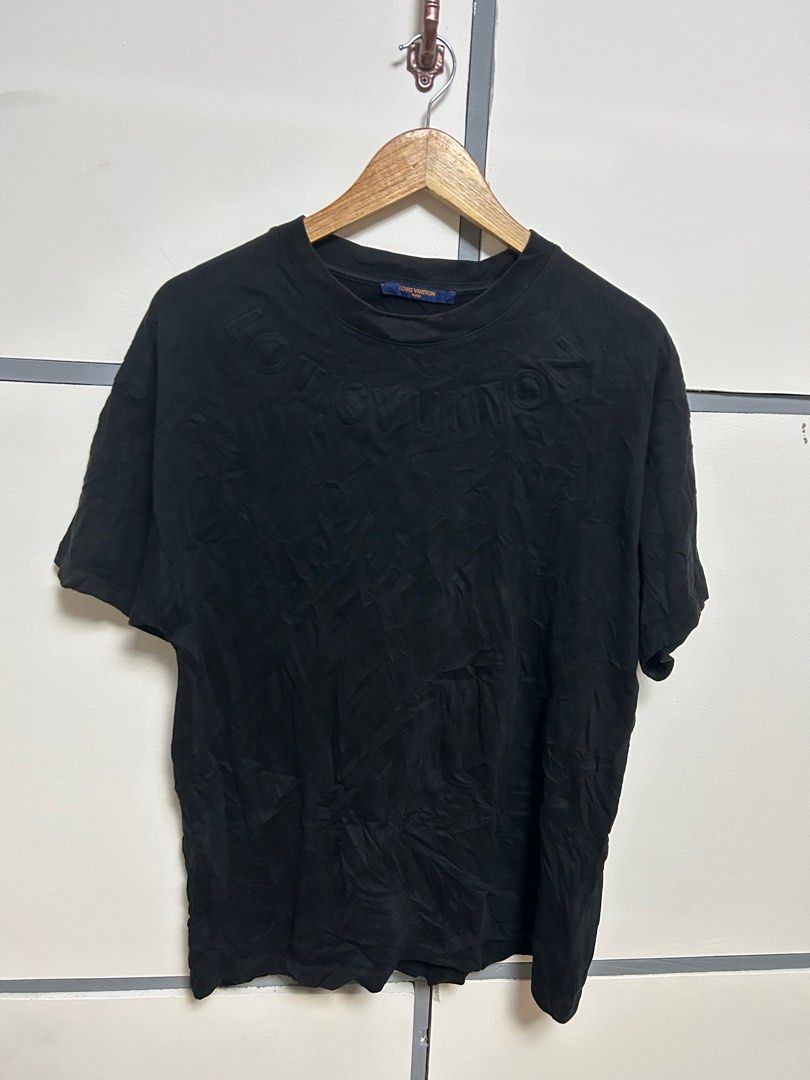 Louis Vuitton Black T-shirt (Category: Luxury Apparel) located in Jordan. Submitted by pareng_j0mar (Listing ID 1419330811, Image 1). Description: - Authentic Louis Vuitton t-shirt - Color: Black - Size: S - Made in Italy - Features embossed Louis Vuitton logo - Crew neck and short sleeves - Includes care instructions and size chart 21 by 28.