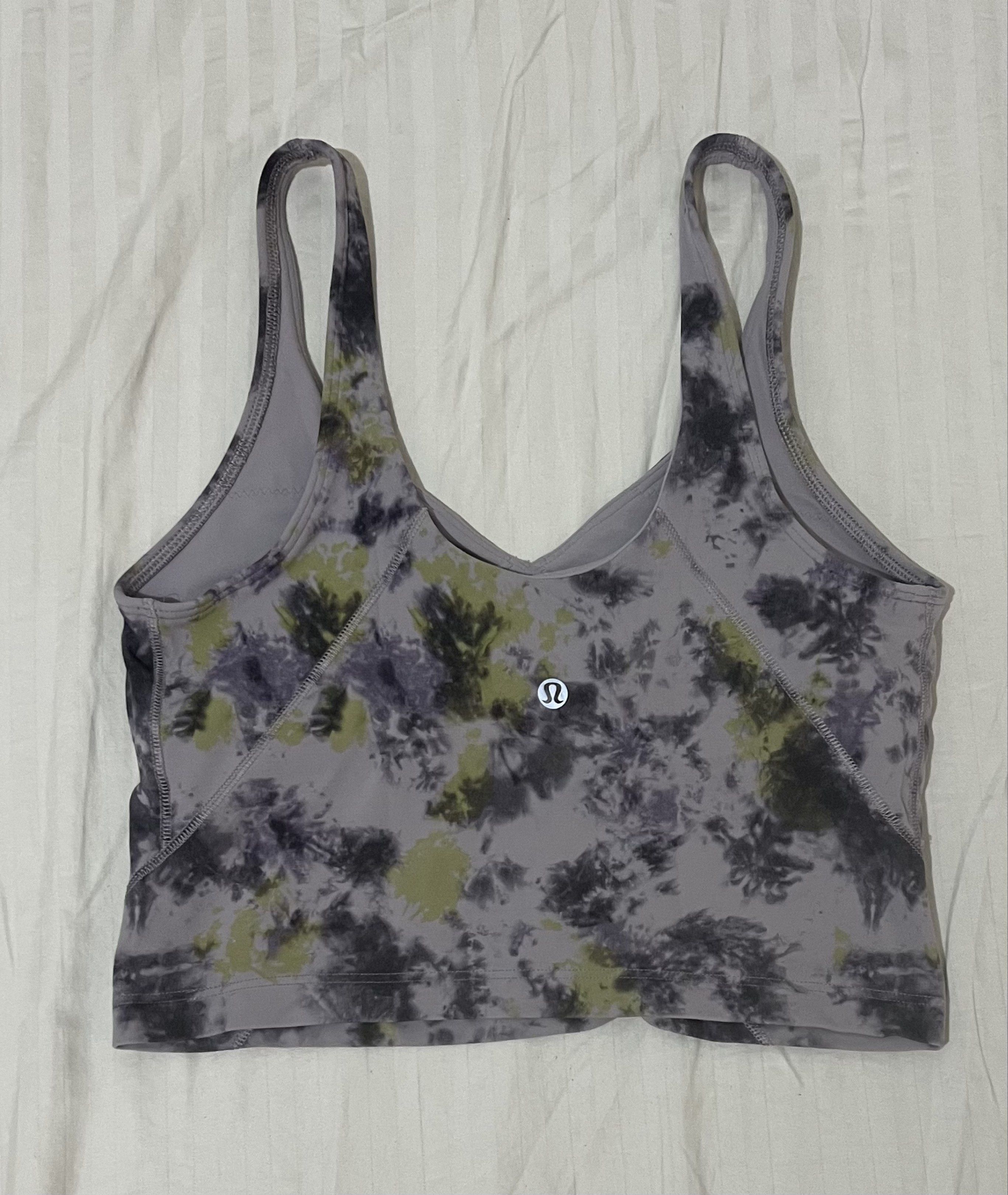 Lululemon Flow Y Bra - Tie Dye (Category: Activewear) located in El Nido. Submitted by rentedplace (Listing ID 1419221687, Image 2). Description: - Lululemon Flow Y Bra - Dot 8 (fits S-M) - Unique tie-dye pattern (purple, green, black) - V-neck and racerback design - Features the Lululemon logo - Comfortable fit - Ideal for low-impact workouts and everyday wear.