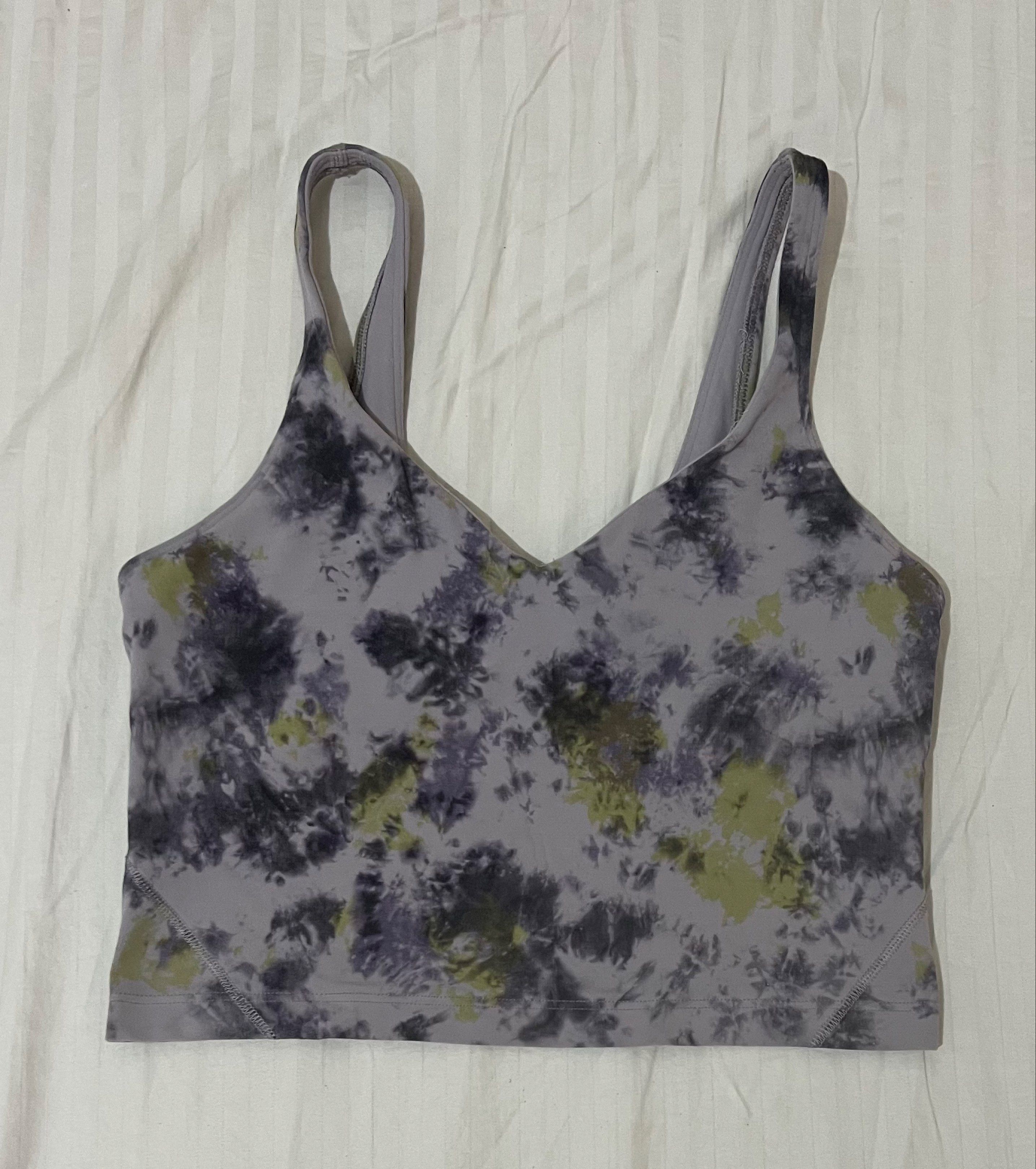 Lululemon Flow Y Bra - Tie Dye (Category: Activewear) located in El Nido. Submitted by rentedplace (Listing ID 1419221687, Image 1). Description: - Lululemon Flow Y Bra - Dot 8 (fits S-M) - Unique tie-dye pattern (purple, green, black) - V-neck and racerback design - Features the Lululemon logo - Comfortable fit - Ideal for low-impact workouts and everyday wear.