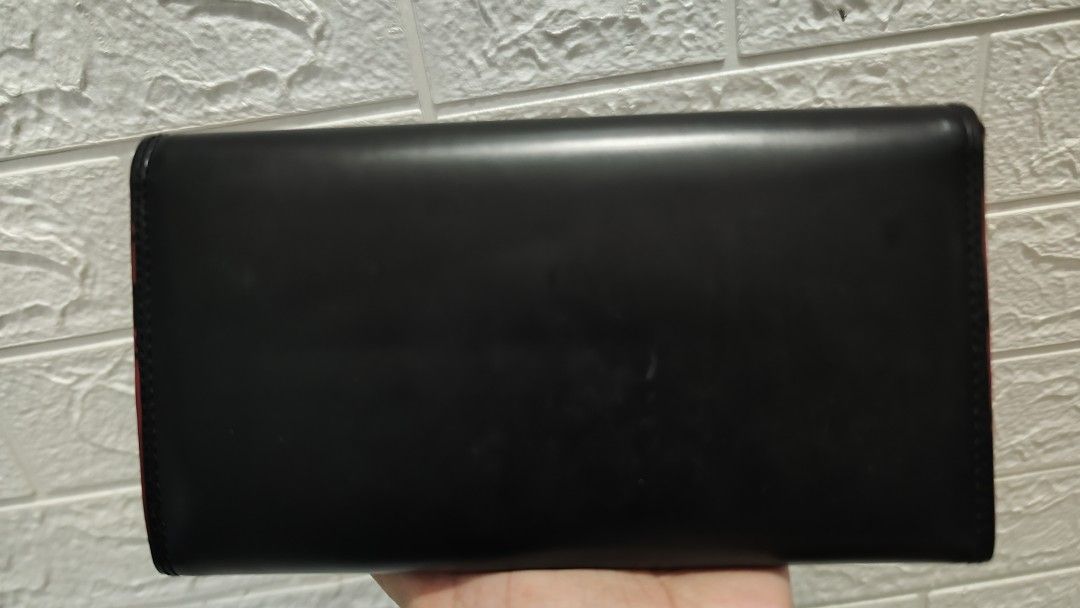 Maldita Black and Red Wallet (Category: Wallets & Card holders) located in Cavite. Submitted by nesstuffandeverything (Listing ID 1419195737, Image 3). Description: - Black Maldita wallet - Red interior - Multiple card slots - Clear ID window - Zippered compartment - Snap closure.