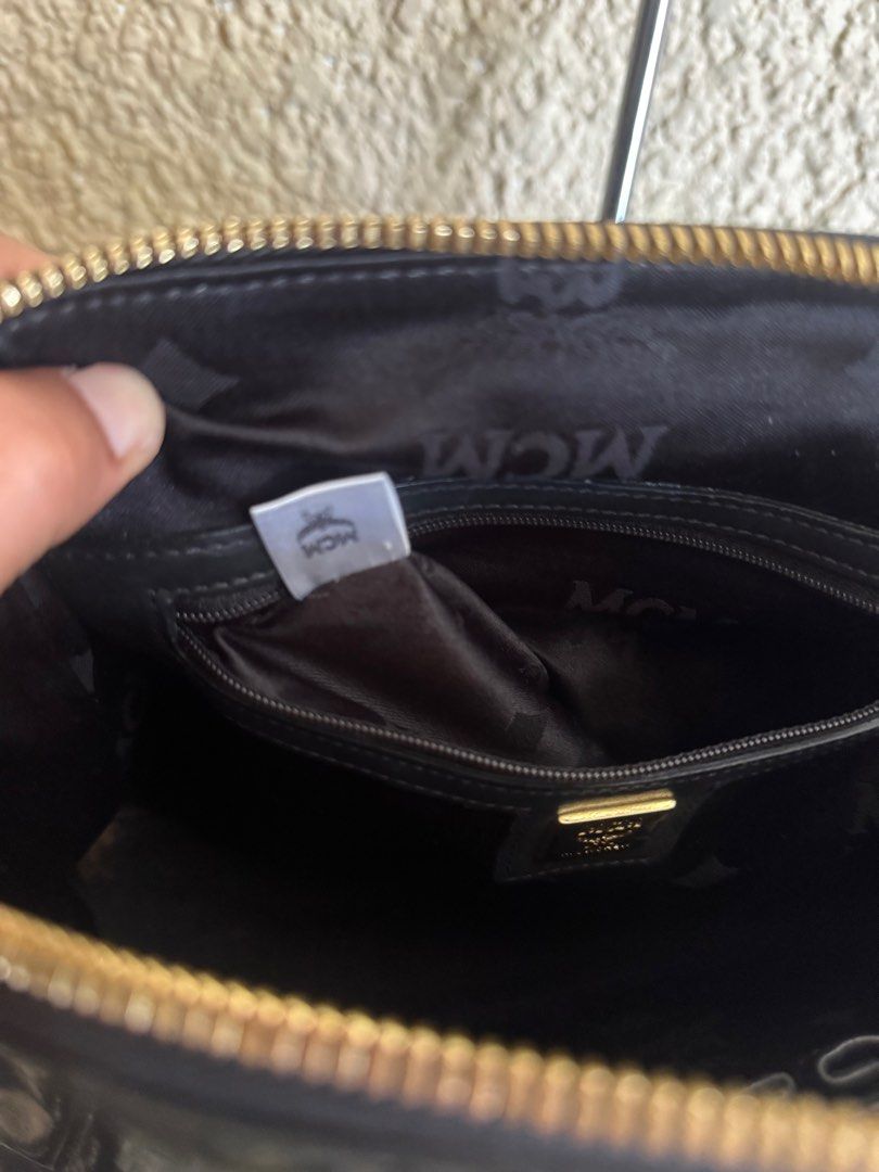 MCM Bowler Bag-original preloved (Category: Luxury Bags & Wallets) located in Manila. Submitted by nylan1227 (Listing ID 1419322353, Image 2). Description: - Authentic MCM bowler bag - Glossy black exterior - Gold-tone hardware - Interior zippered pocket and slip pocket - Double top handles - Detachable shoulder strap (missing) - Includes MCM dust bag.