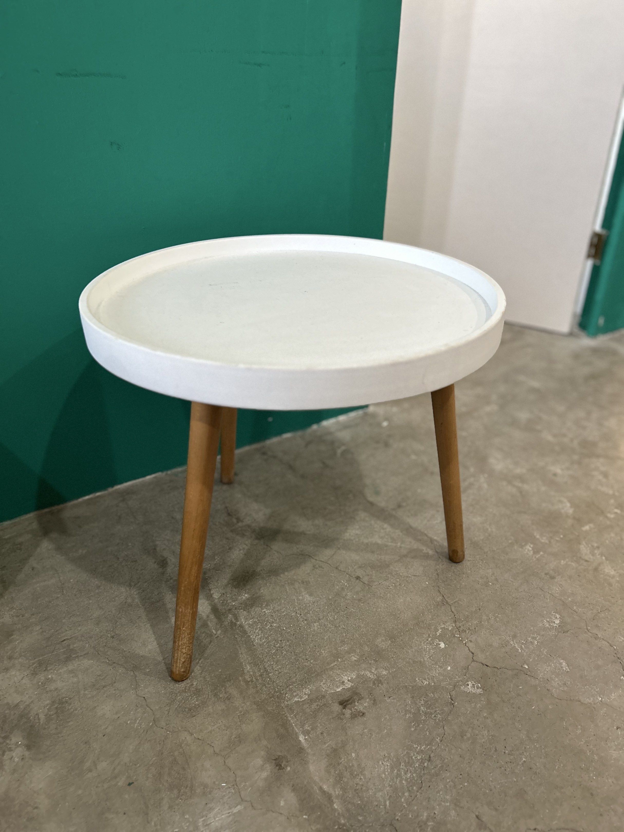 Minimalist White Round Side Table (Category: Tables & Sets) located in Quezon City. Submitted by clearshelf (Listing ID 1419198932, Image 1). Description: Minimalist round side table with wooden legs. Light wear on the surface but still sturdy and functional. Great for living room, bedroom, or office corners. 3 pieces available.