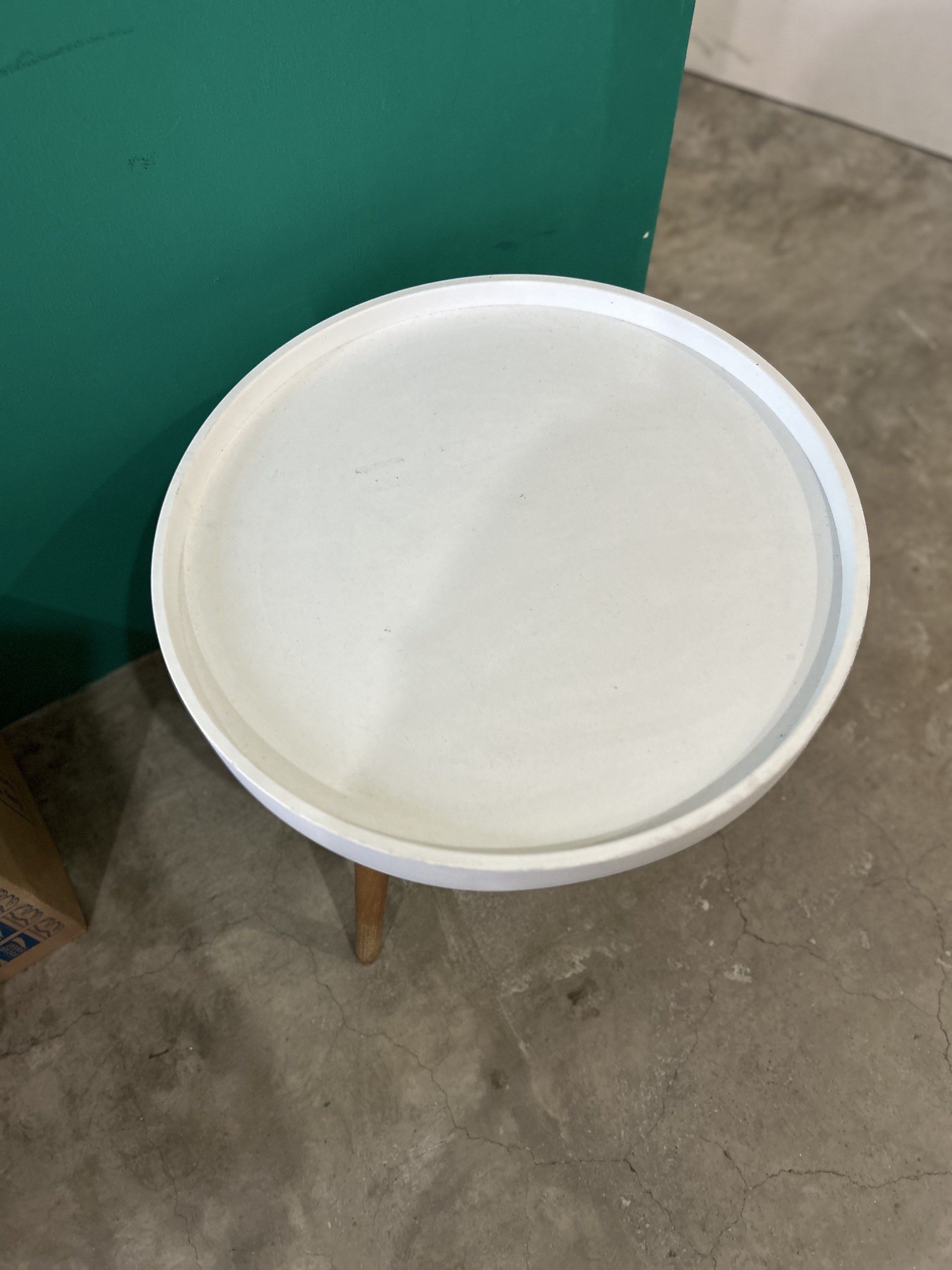 Minimalist White Round Side Table (Category: Tables & Sets) located in Quezon City. Submitted by clearshelf (Listing ID 1419198932, Image 2). Description: Minimalist round side table with wooden legs. Light wear on the surface but still sturdy and functional. Great for living room, bedroom, or office corners. 3 pieces available.