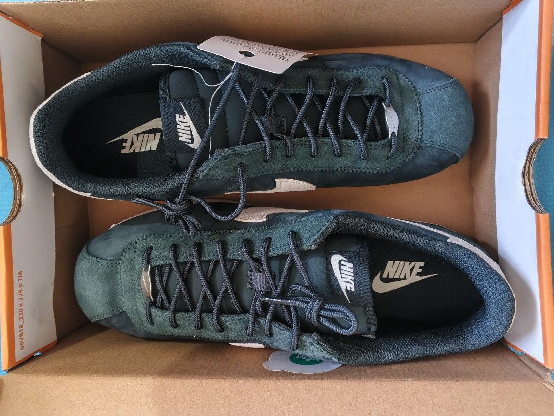 Nike Cortez PRM Seaweed/Sail (Category: Sneakers) located in Bacoor. Submitted by nmcave (Listing ID 1419241776, Image 2). Description: - Nike Cortez PRM - Colorway: Seaweed/Sail - Size: 13 - Features: Dark blue green / seaweed suede upper, white swoosh and midsole - Condition: Brand new with original tags - Includes: Original box - Made in Indonesia.