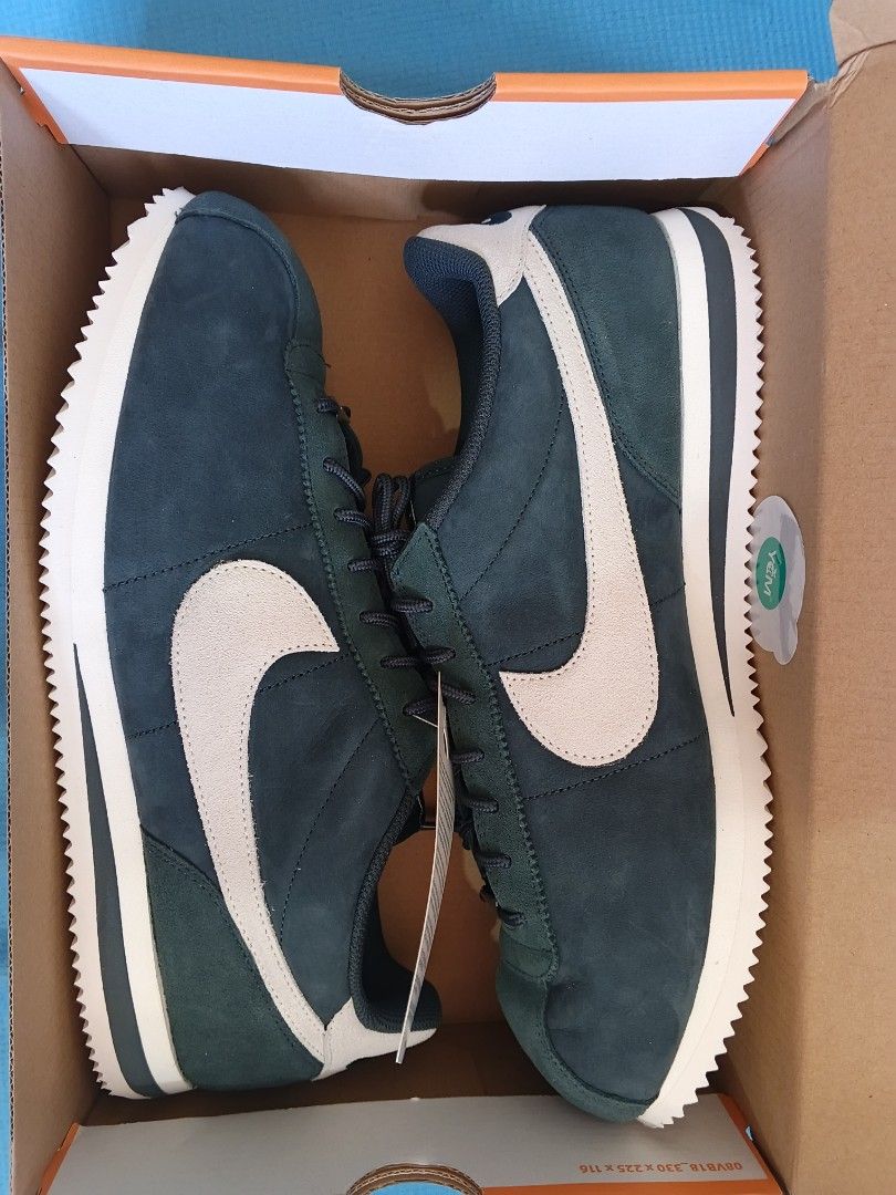 Nike Cortez PRM Seaweed/Sail (Category: Sneakers) located in Bacoor. Submitted by nmcave (Listing ID 1419241776, Image 1). Description: - Nike Cortez PRM - Colorway: Seaweed/Sail - Size: 13 - Features: Dark blue green / seaweed suede upper, white swoosh and midsole - Condition: Brand new with original tags - Includes: Original box - Made in Indonesia.