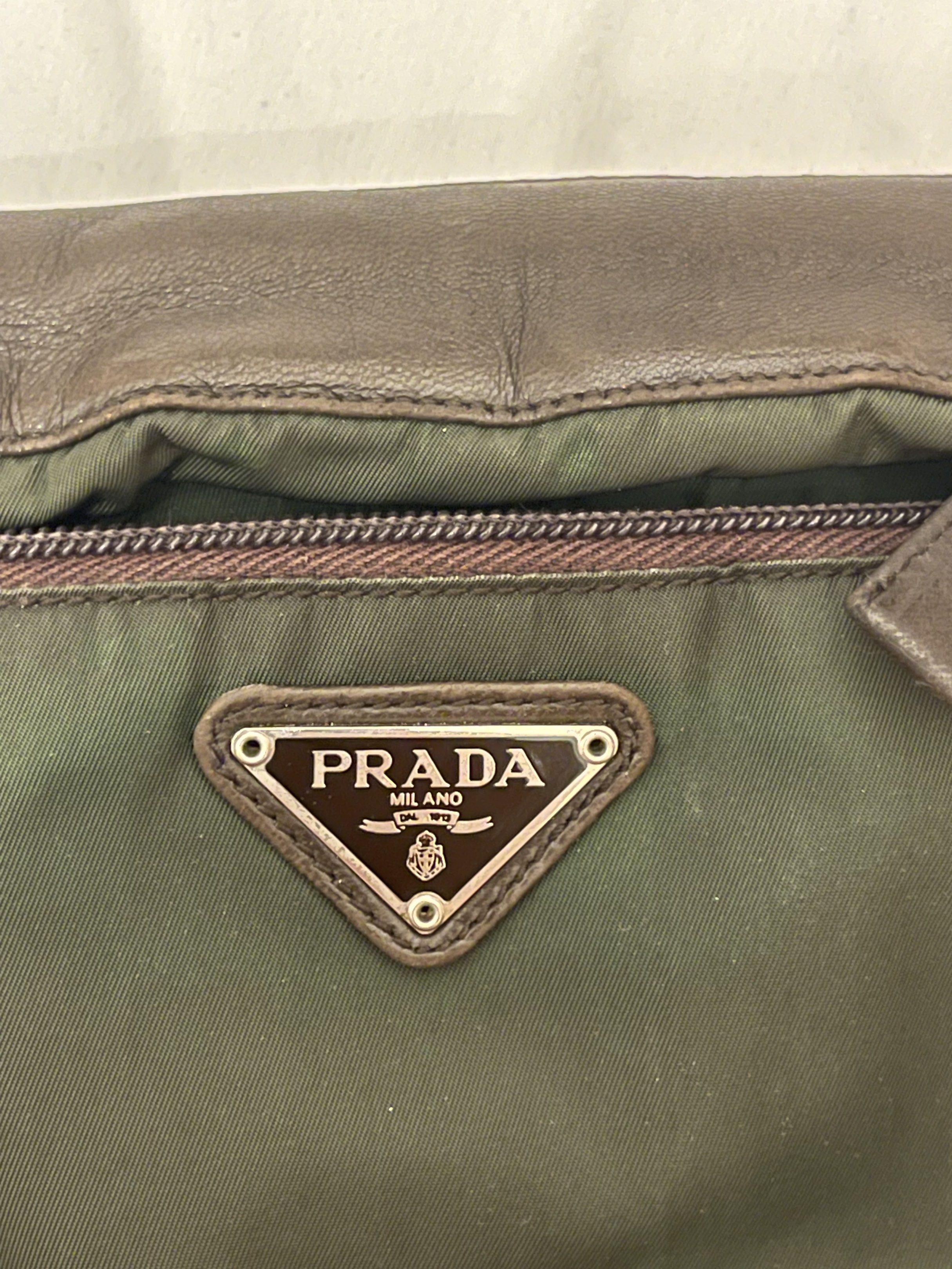 Prada Crossbody Bag/pouch (Category: Luxury Bags & Wallets) located in Marilao. Submitted by wardrovearchives (Listing ID 1419362189, Image 3). Description: Authentic Prada Milano nylon & leather bag • Classic triangle logo • Made in Italy hardware • Durable Prada tessuto nylon • Vintage piece with natural signs of age • Spacious, lightweight, and timeless, belt strap not inlcuded This is a pre-loved vintage item — expect gentle wear that adds ch