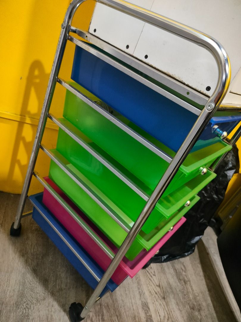 Rolling Storage Cart with Drawers (Category: Storage Boxes & Baskets) located in Manila. Submitted by msadlawan646634 (Listing ID 1419256715, Image 2). Description: - Rolling storage cart with six drawers - Colors: Blue, Green, Pink - Chrome frame - Easy mobility with wheels - Round knobs for easy opening - Practical storage for various items.