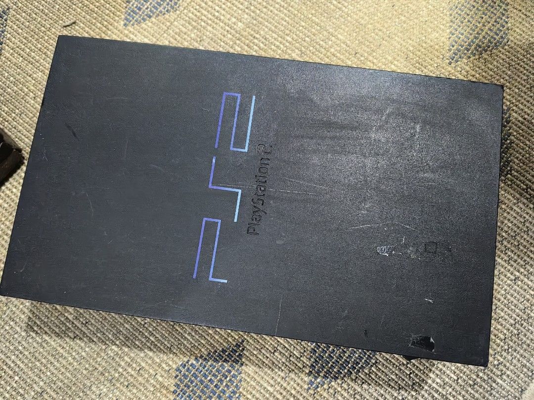 Sony PlayStation 2 Console (Category: PlayStation) located in Quezon City. Submitted by flat.earther23 (Listing ID 1419199516, Image 1). Description: - Sony PlayStation 2 console - Features the PlayStation 2 logo - Color: Black - Includes memory card and USB ports - Back ports and power switch included included -deffective loading tray.