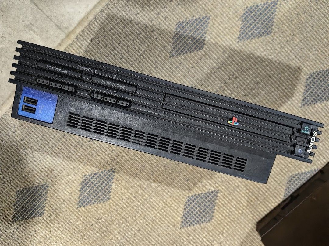 Sony PlayStation 2 Console (Category: PlayStation) located in Quezon City. Submitted by flat.earther23 (Listing ID 1419199516, Image 3). Description: - Sony PlayStation 2 console - Features the PlayStation 2 logo - Color: Black - Includes memory card and USB ports - Back ports and power switch included included -deffective loading tray.
