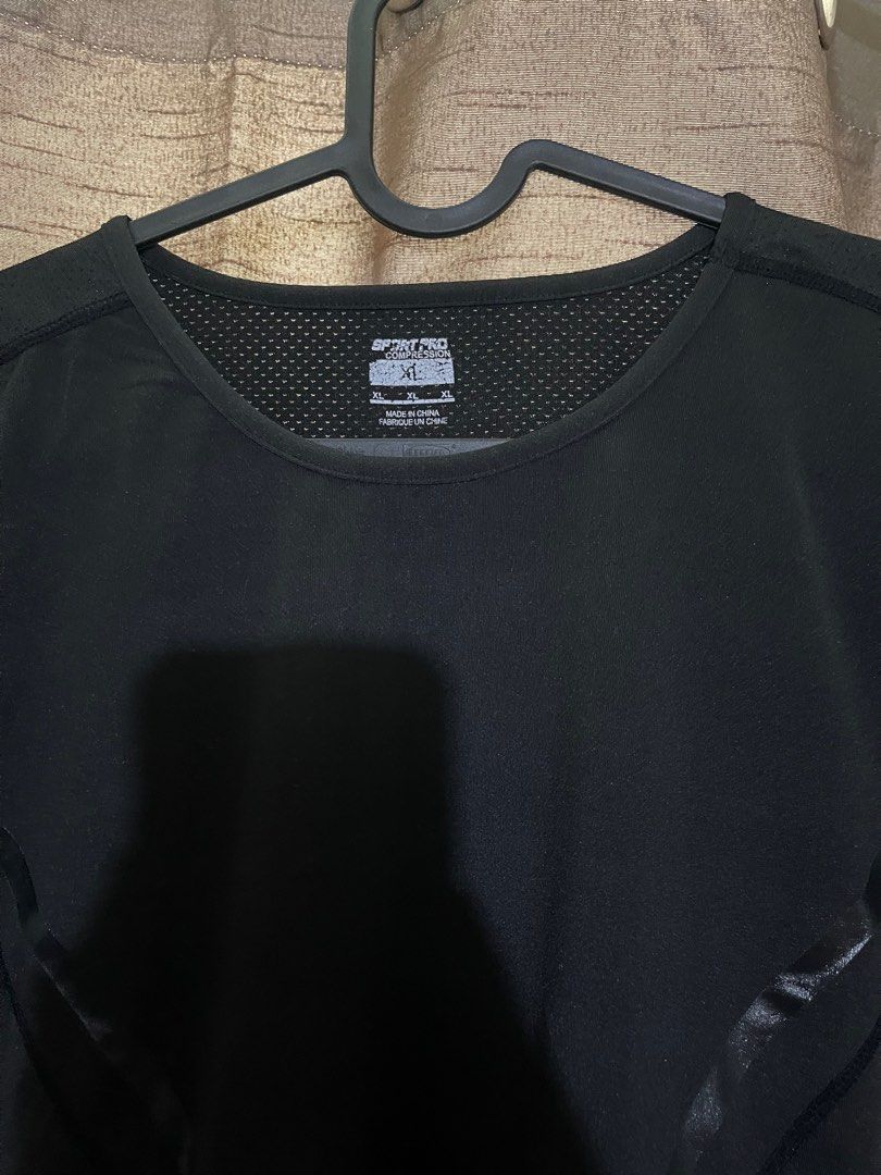 Sport Pro Black Compression Shirt XL (Category: Activewear) located in Makati City. Submitted by afterpiece (Listing ID 1419222940, Image 2). Description: Black Sport Pro Compression shirt Size: XL 16x23-.5" - Mesh panel on upper back and neckline - Short sleeves.