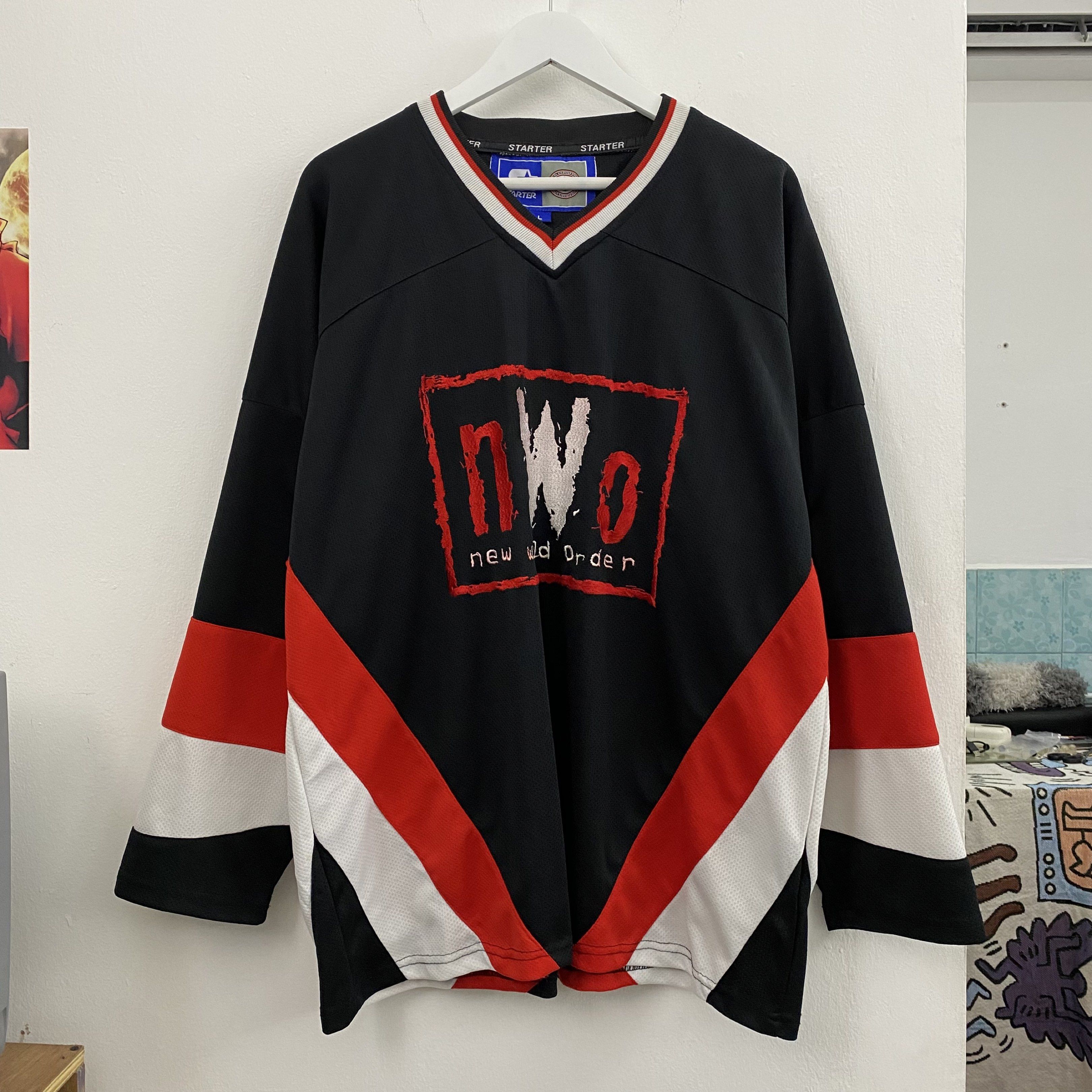 Starter NWO Hockey Jersey (Category: Activewear) located in Cavite. Submitted by mana__ (Listing ID 1419378654, Image 1). Description: - Vintage Starter hockey jersey - Features NWO (New World Order) logo - Number 9 on the back - Color: Black with red and white accents - Size: Large - V-neck collar with Starter branding - Issue : bleed - Dimension Large Width - 28.5 Length - 30 .