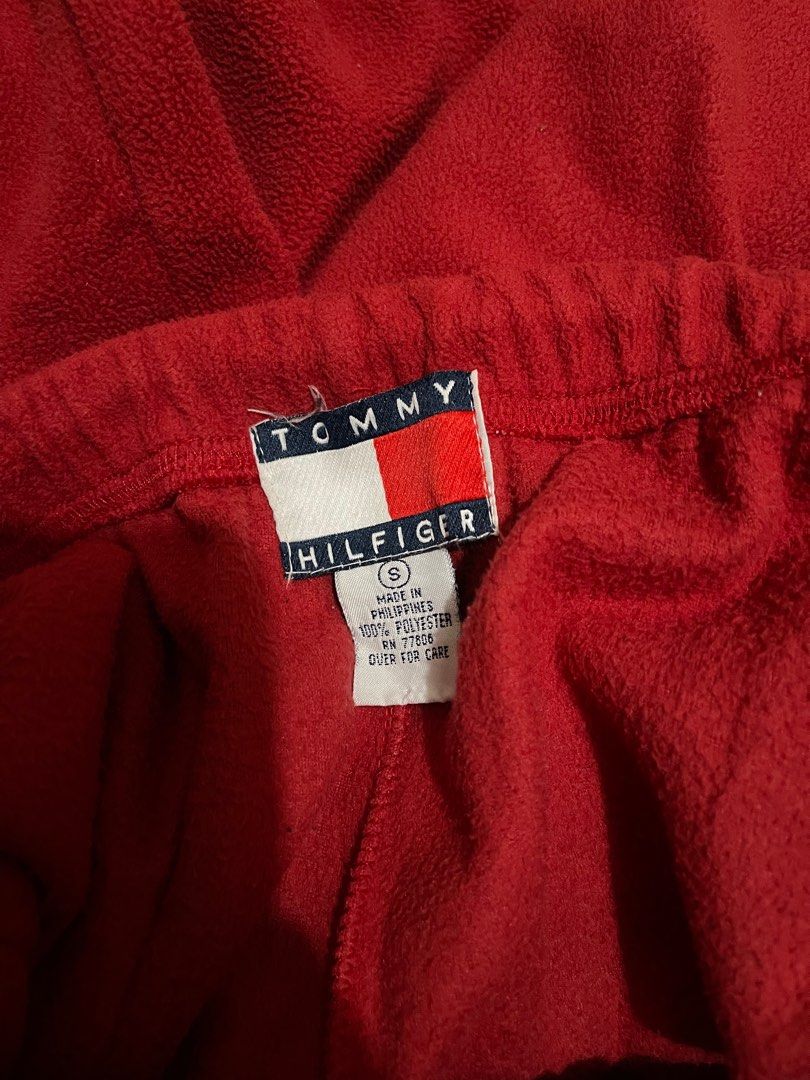 Tommy Hilfiger Fleece Pajama (Category: Joggers) located in Makati City. Submitted by afterpiece (Listing ID 1419219953, Image 3). Description: - Tommy Hilfiger red fleece pants - Size: S, fits 26-32, 41" length - Features: Adjustable waistband, single back pocket - Perfect for casual wear - Comfortable and stylish.