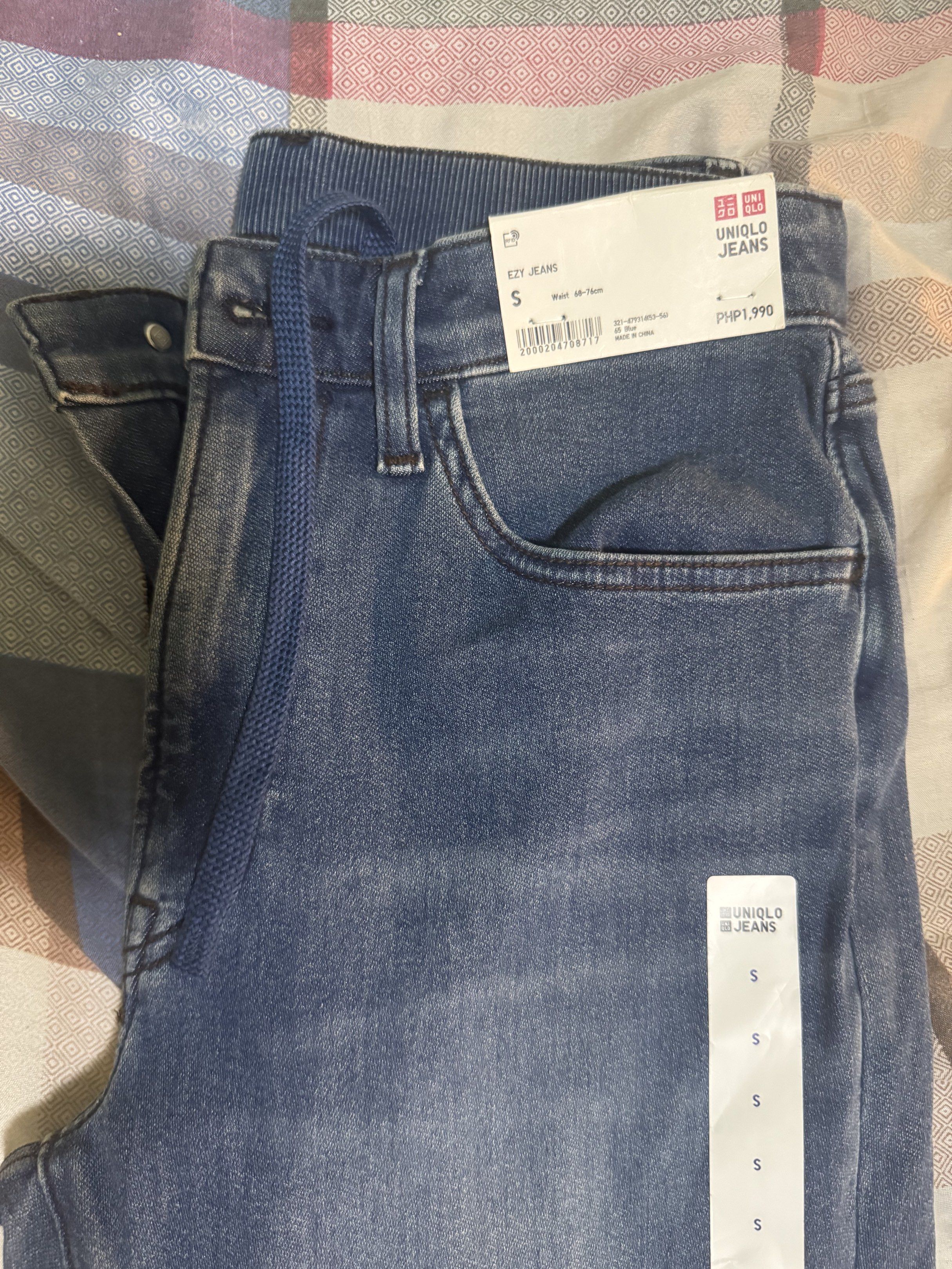 Uniqlo EZY Jeans - Size S (Category: Jeans) located in Manila. Submitted by andreaaax (Listing ID 1419288966, Image 1). Description: - Uniqlo EZY Jeans - Size: S - Color: Medium Blue Wash - Features: Drawstring waist, five-pocket design - Material: Cotton blend (cotton, lyocell, polyester, spandex) - Original Price: PHP1,990.