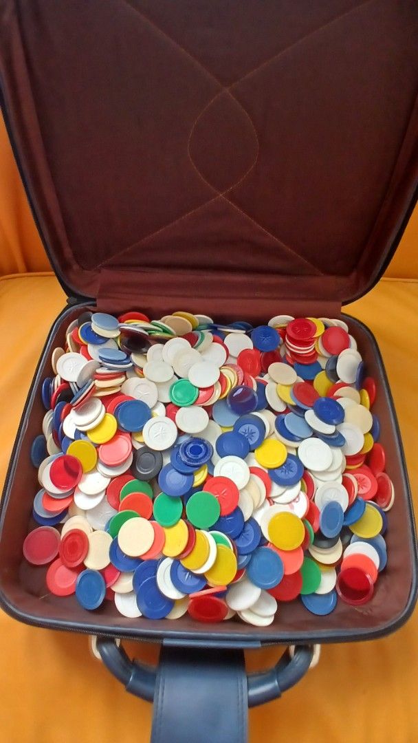Vintage Poker Chip Set with Case (Category: Board Games & Puzzles) located in San Juan City. Submitted by frugalmomph (Listing ID 1419239242, Image 2). Description: - Vintage poker chip set - Includes a black case with handle - Case made of leather-like material - Contains a large assortment of colorful poker chips.