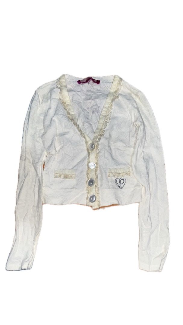 White Cropped Cardigan with Ruffle Trim (Category: Coats, Jackets and Outerwear) located in Caloocan City. Submitted by beatrizpad09003 (Listing ID 1419313350, Image 1). Description: - White cropped cardigan - Textured fabric - V-neckline with ruffle trim - Three-button closure - Ruffle-detailed pockets - Heart-shaped emblem with 'P' - Long sleeves -small/med.