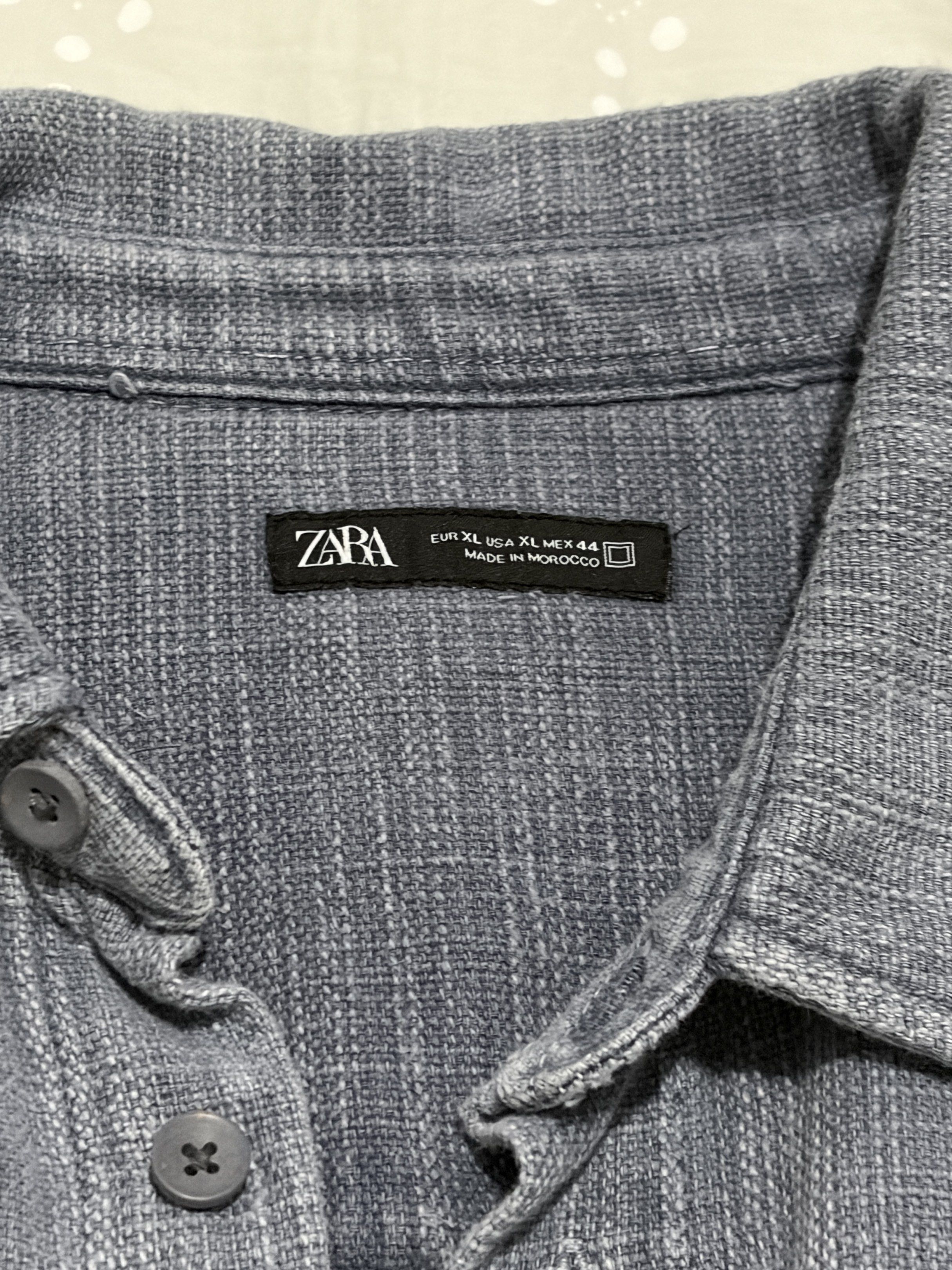 Zara Short Sleeve Shirt (Category: Shirts) located in Paranaque City. Submitted by sandman___ (Listing ID 1419291104, Image 2). Description: - Zara short sleeve shirt - Size: XL - Features a single chest pocket - Button-down closure - Made in Morocco Never used DM for more information!.