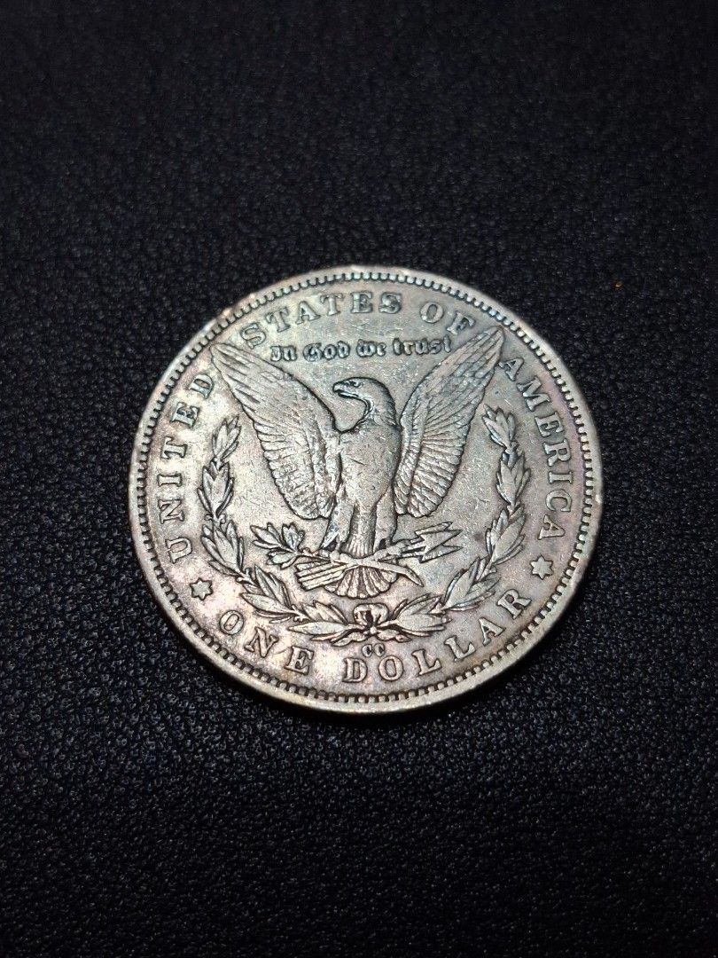 1890 Morgan Silver Dollar Coin CC Carson City (Category: Currency) located in Quezon City. Submitted by ejo23 (Listing ID 1422404565, Image 2). Description: 1890 CC (Carson City) Morgan Silver Dollar. Condition is notably fine. Ungraded, but appears to be around VF/Very Fine. Has the rare Carson City CC mint mark. Non magnetic, 90% silver. 26.5 grams when put on a weighing scale so it's within the common tolerance for lightly circulated coins. Ha