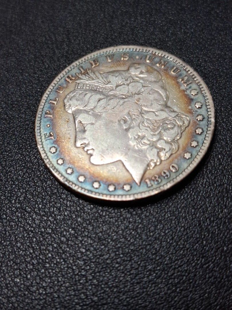 1890 Morgan Silver Dollar Coin CC Carson City (Category: Currency) located in Quezon City. Submitted by ejo23 (Listing ID 1422404565, Image 3). Description: 1890 CC (Carson City) Morgan Silver Dollar. Condition is notably fine. Ungraded, but appears to be around VF/Very Fine. Has the rare Carson City CC mint mark. Non magnetic, 90% silver. 26.5 grams when put on a weighing scale so it's within the common tolerance for lightly circulated coins. Ha