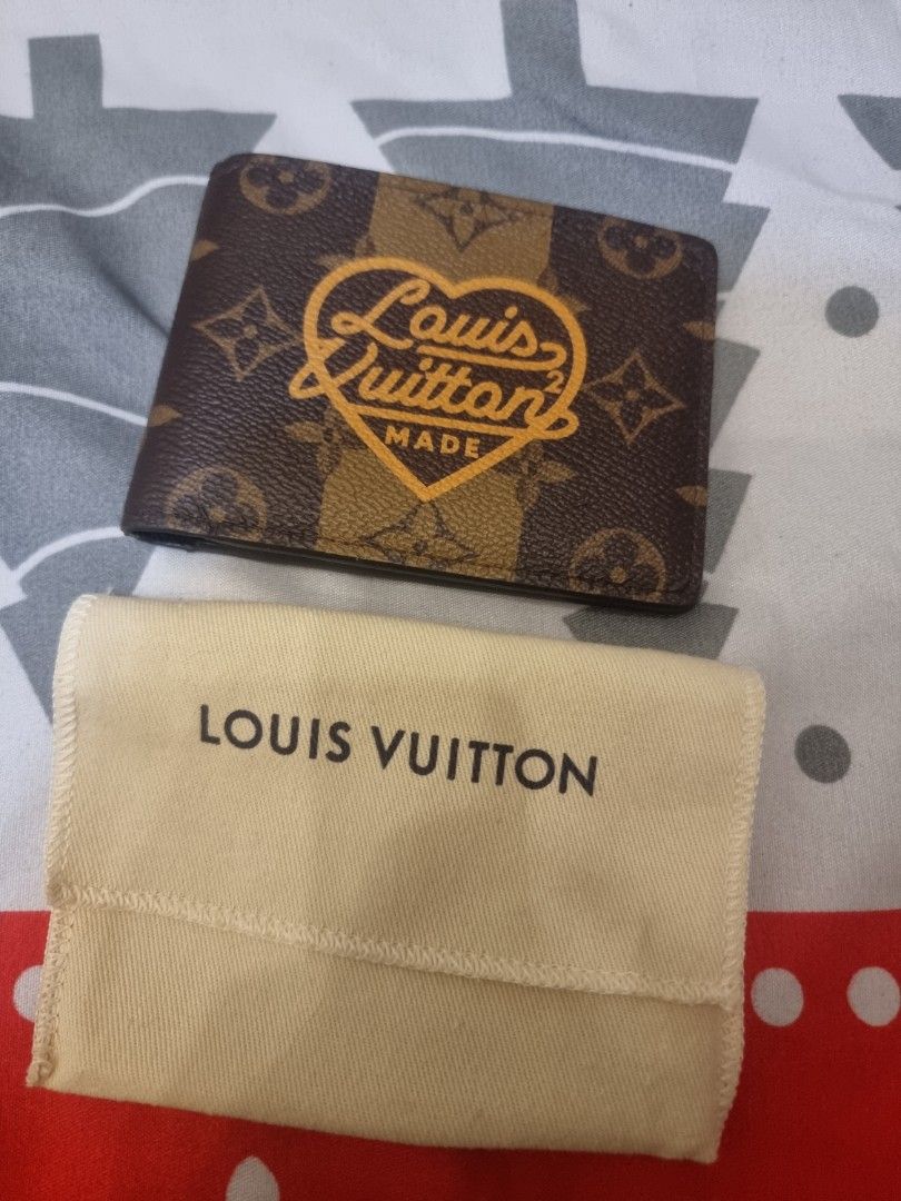 Authentic Louis Vuitton x Nigo Multiple Wallet (Category: Luxury Bags & Wallets) located in Pasig City. Submitted by sai1032013 (Listing ID 1422419912, Image 1). Description: - Authentic Louis Vuitton x Nigo Multiple Wallet - Monogram Stripes Brown - Features a unique heart-shaped design - Includes a dust bag - Multiple card slots and compartments - Dark brown interior.