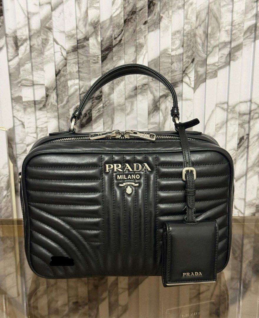 authentic PRADA DIAGRAMME TOP HANDLE ✨ (Category: Luxury Bags & Wallets) located in Quezon City. Submitted by jhaediah (Listing ID 1390141025, Image 2). Description: PRADA DIAGRAMME TOP HANDLE ✨2-20 Guaranteed authentic 💯 Box & Paper bag Rank A condition.