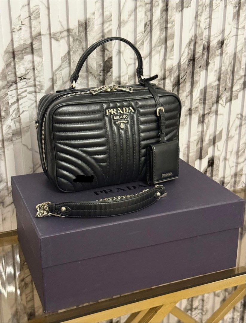 authentic PRADA DIAGRAMME TOP HANDLE ✨ (Category: Luxury Bags & Wallets) located in Quezon City. Submitted by jhaediah (Listing ID 1390141025, Image 1). Description: PRADA DIAGRAMME TOP HANDLE ✨2-20 Guaranteed authentic 💯 Box & Paper bag Rank A condition.