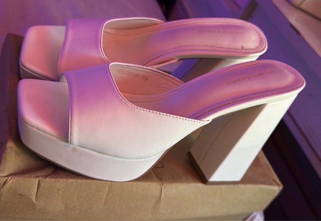 Bimba y Lola White Platform Heels Size 39 (Category: Heels) located in Taguig. Submitted by mamicakes_420 (Listing ID 1422400710, Image 2). Description: - Bimba y Lola platform heels - White color - Size 39 - Square toe - Chunky heel - Minimal signs of wear - Includes original box - Adds elegance to any outfit.