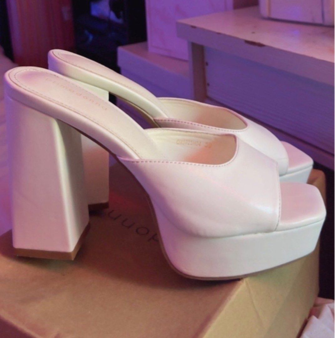 Bimba y Lola White Platform Heels Size 39 (Category: Heels) located in Taguig. Submitted by mamicakes_420 (Listing ID 1422400710, Image 1). Description: - Bimba y Lola platform heels - White color - Size 39 - Square toe - Chunky heel - Minimal signs of wear - Includes original box - Adds elegance to any outfit.