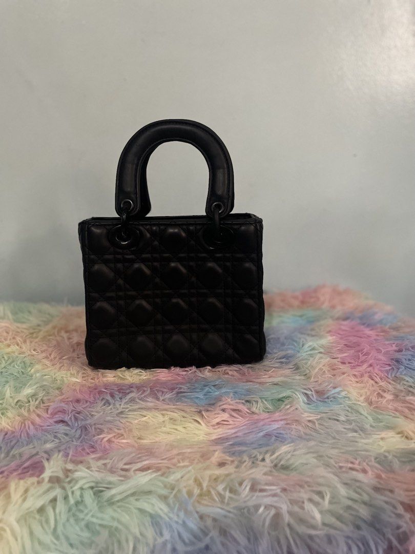 Black Quilted Handbag (Category: Luxury Bags & Wallets) located in Pasig City. Submitted by ladyboss1012 (Listing ID 1422484670, Image 2). Description: - Black quilted handbag - Diamond pattern design - Includes a charm - Features a top handle - Structured shape - Made of leather.