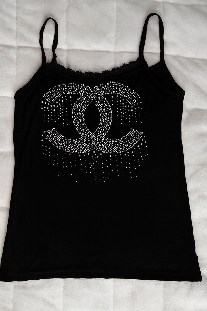 Black Rhinestone Tank Top (Category: Sleeveless) located in Quezon City. Submitted by rhaez (Listing ID 1422443297, Image 1). Description: no missing rhinestones chanel logo - Black tank top - Rhinestone embellishments - Spaghetti straps - Lace trim neckline - Stylish and versatile.
